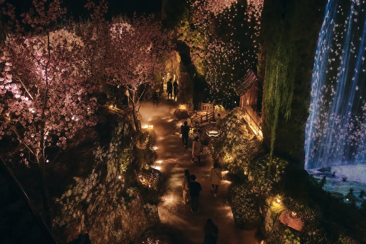Immersive walk-through attraction with projection mapping and a misty forest path