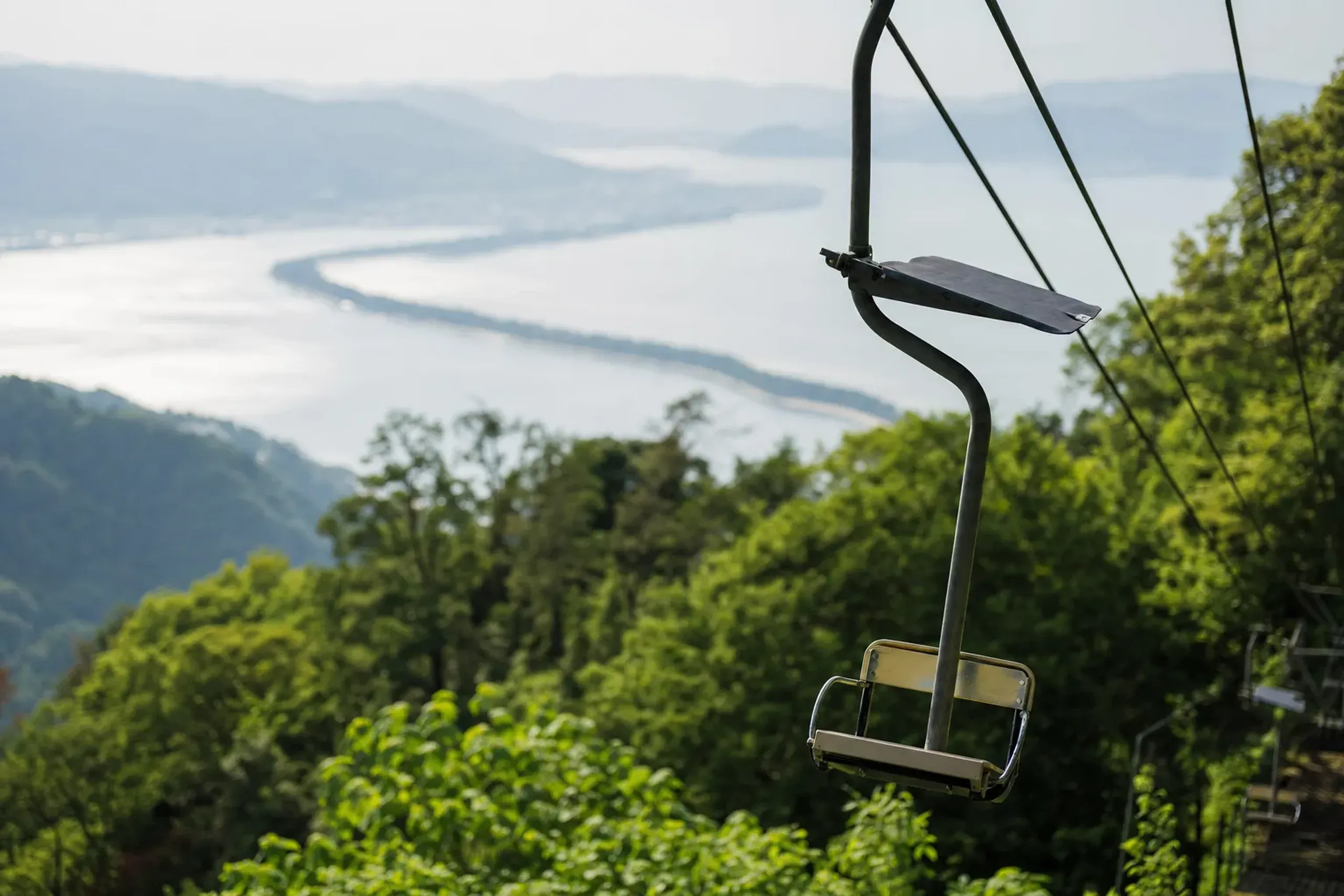 The cable car and open chairlift ascending Mount Monju to Amanohashidate View Land above Miyazu Bay