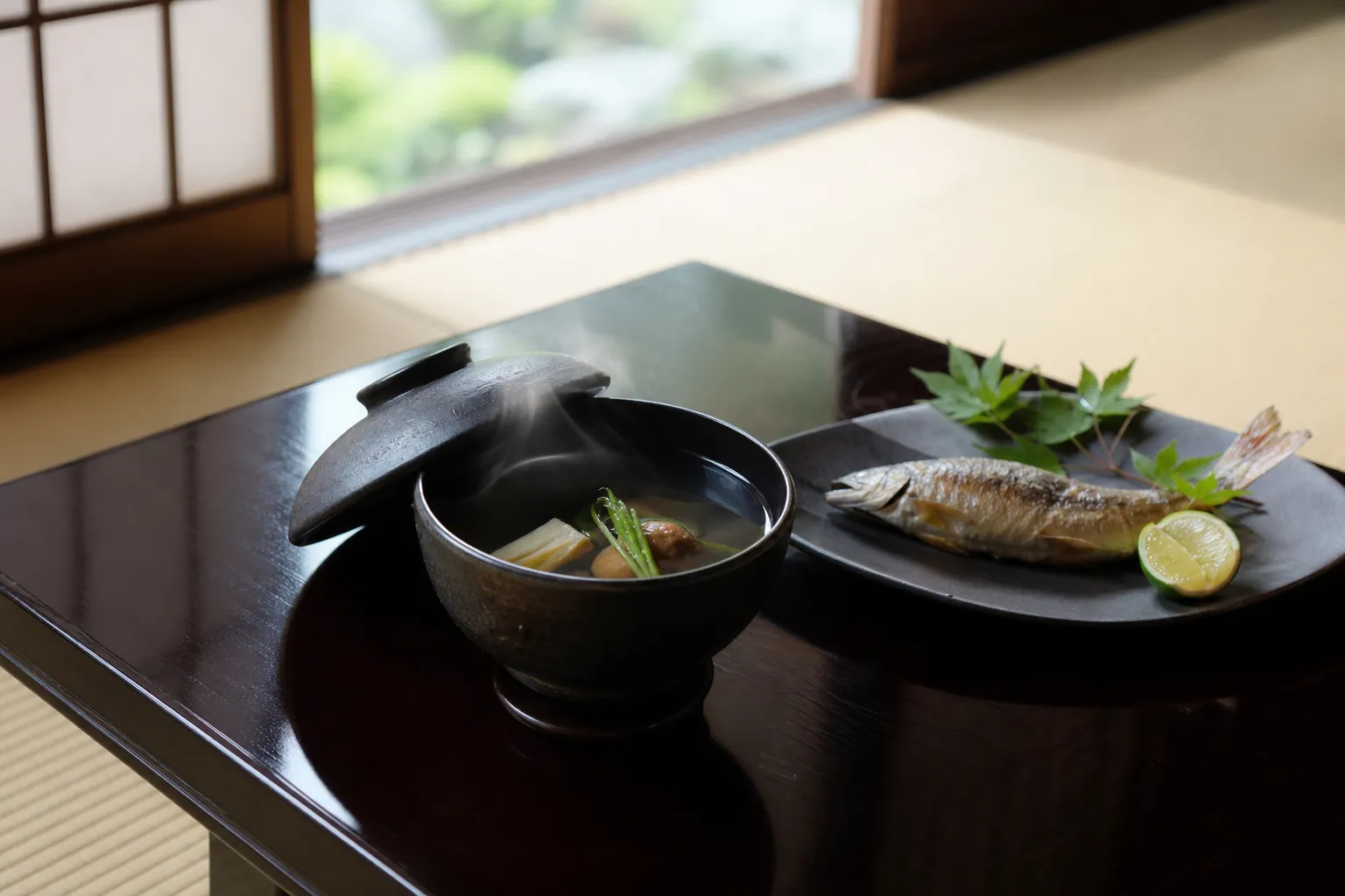 A refined summer kaiseki course served in a traditional room, matching the light pacing of an ukai evening
