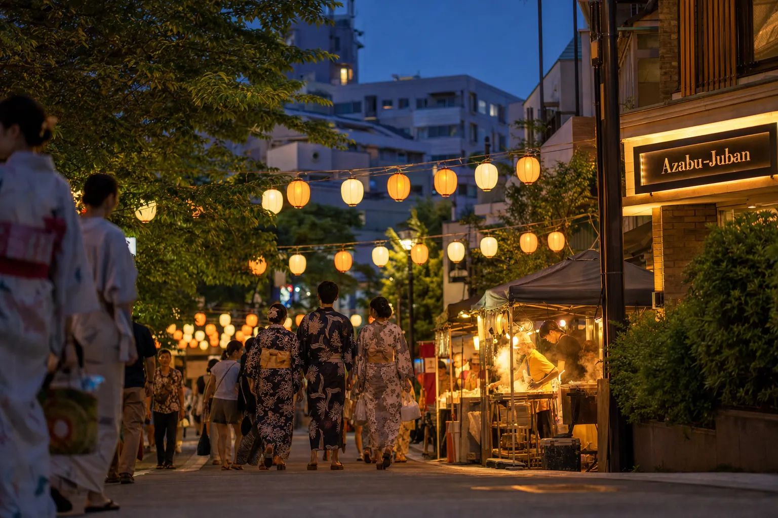 Lantern-lit Tokyo neighborhood festival street with summer yukata and food stalls