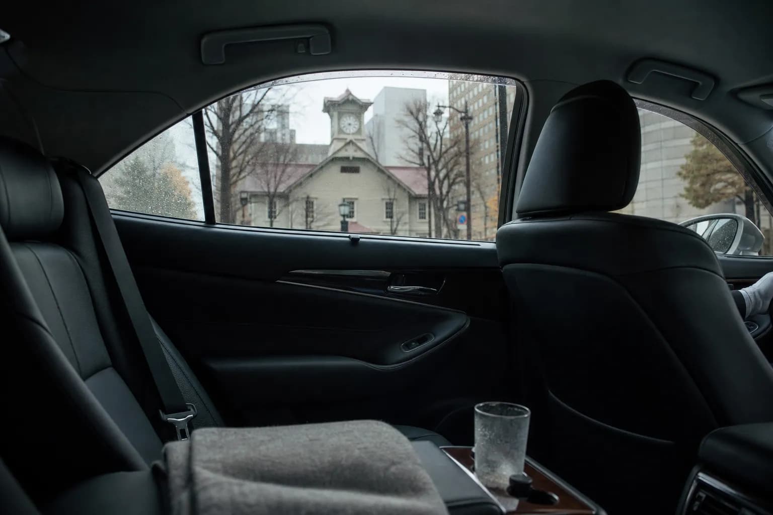 Interior of a luxury chauffeured vehicle on a quiet central Sapporo street