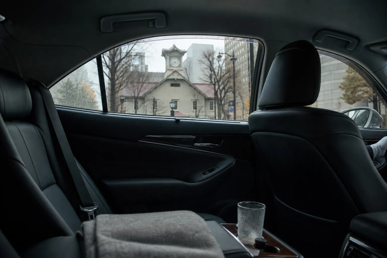Interior of a luxury chauffeured vehicle on a quiet central Sapporo street
