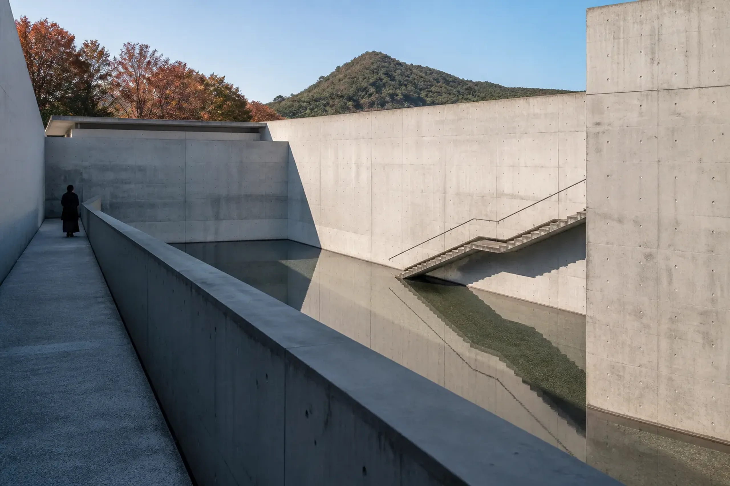 Concrete walls and water features at the Garden of Fine Arts Kyoto designed by Tadao Ando