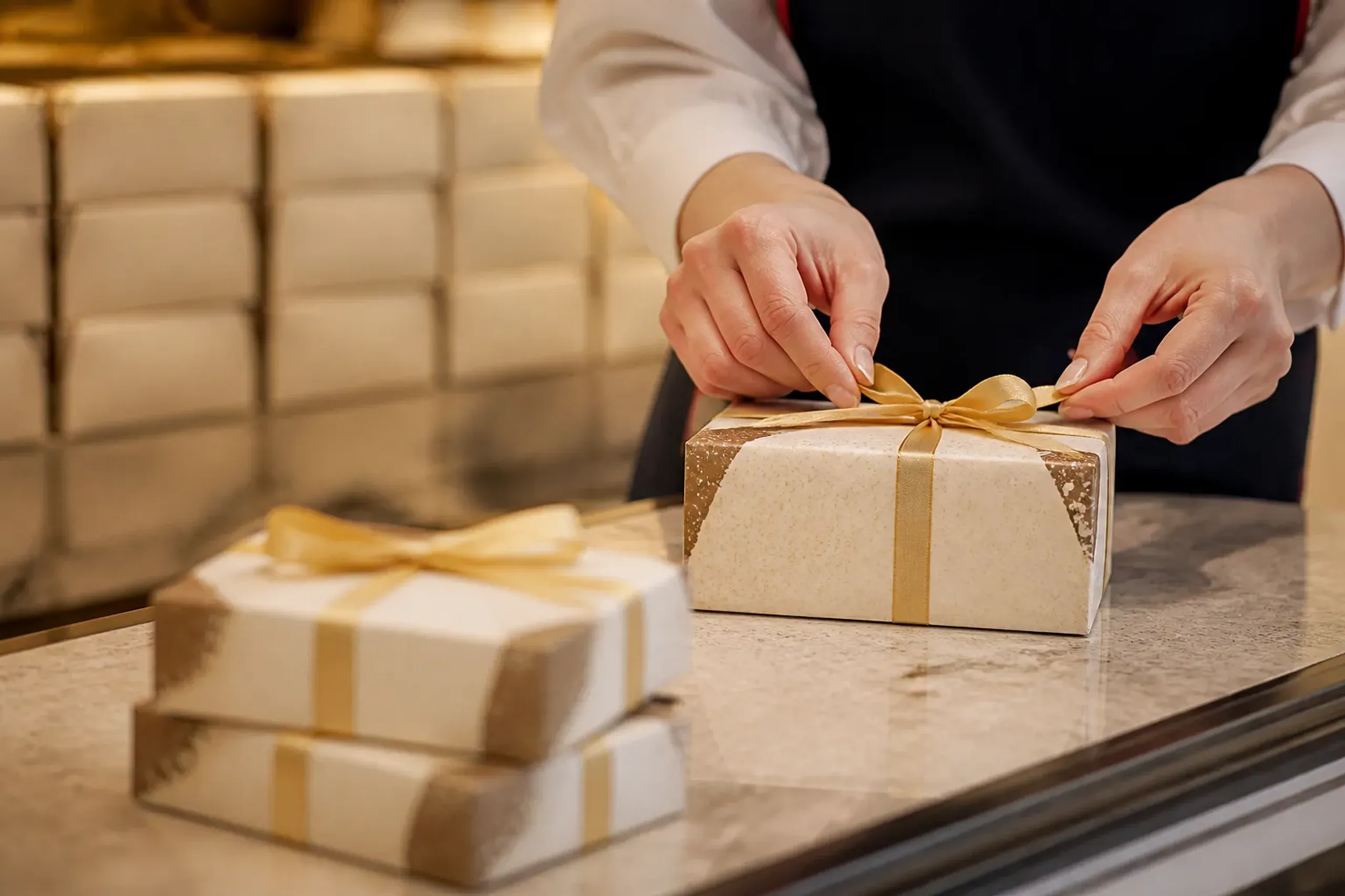 Japanese confectionery gift boxes being wrapped at a depachika counter