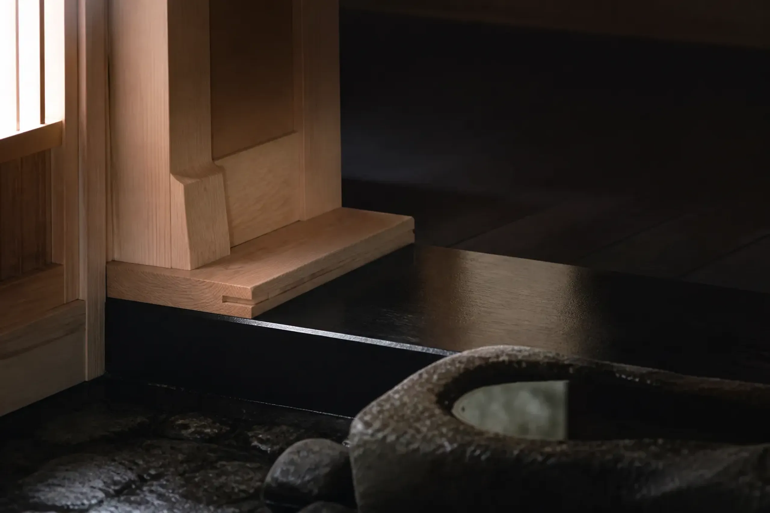 Close-up of new cedar wood joinery and minimalist ryokan architectural detail