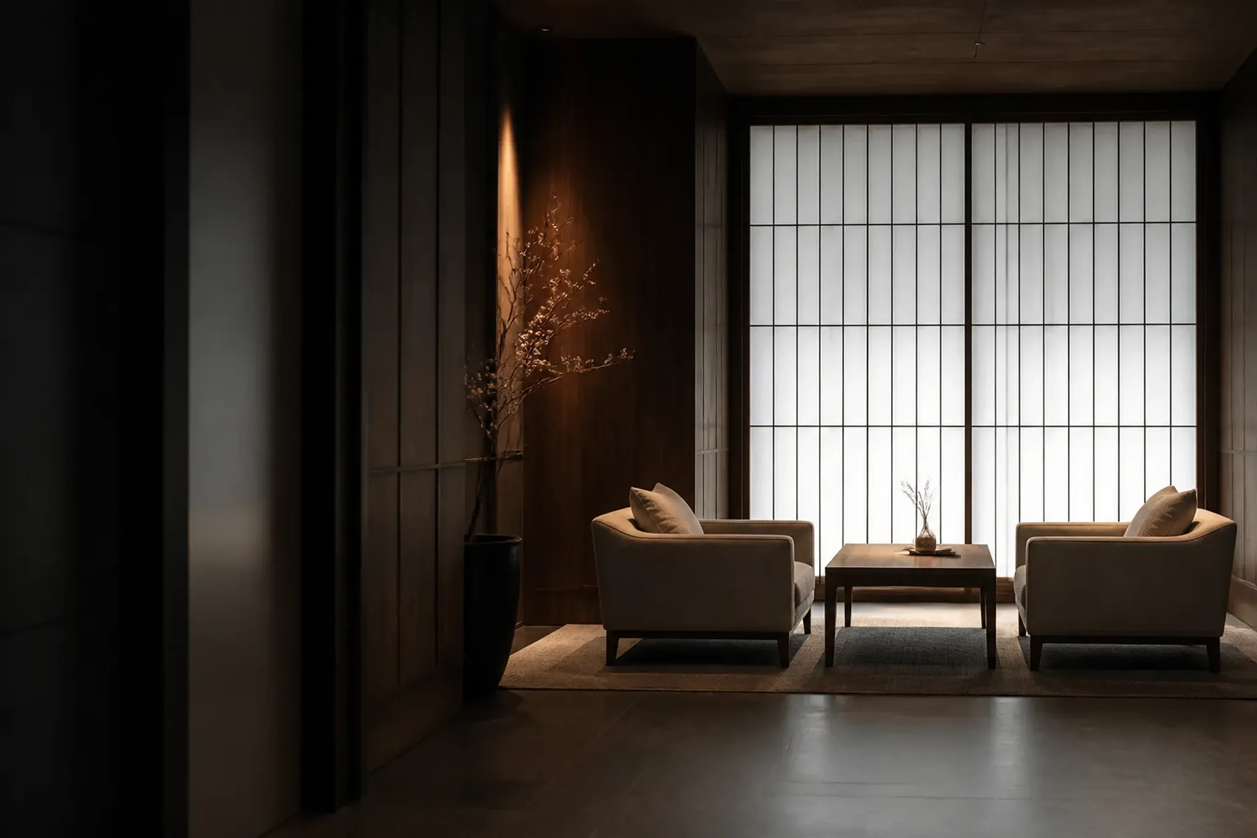 Small calm luxury hotel lobby with warm wood and low lighting