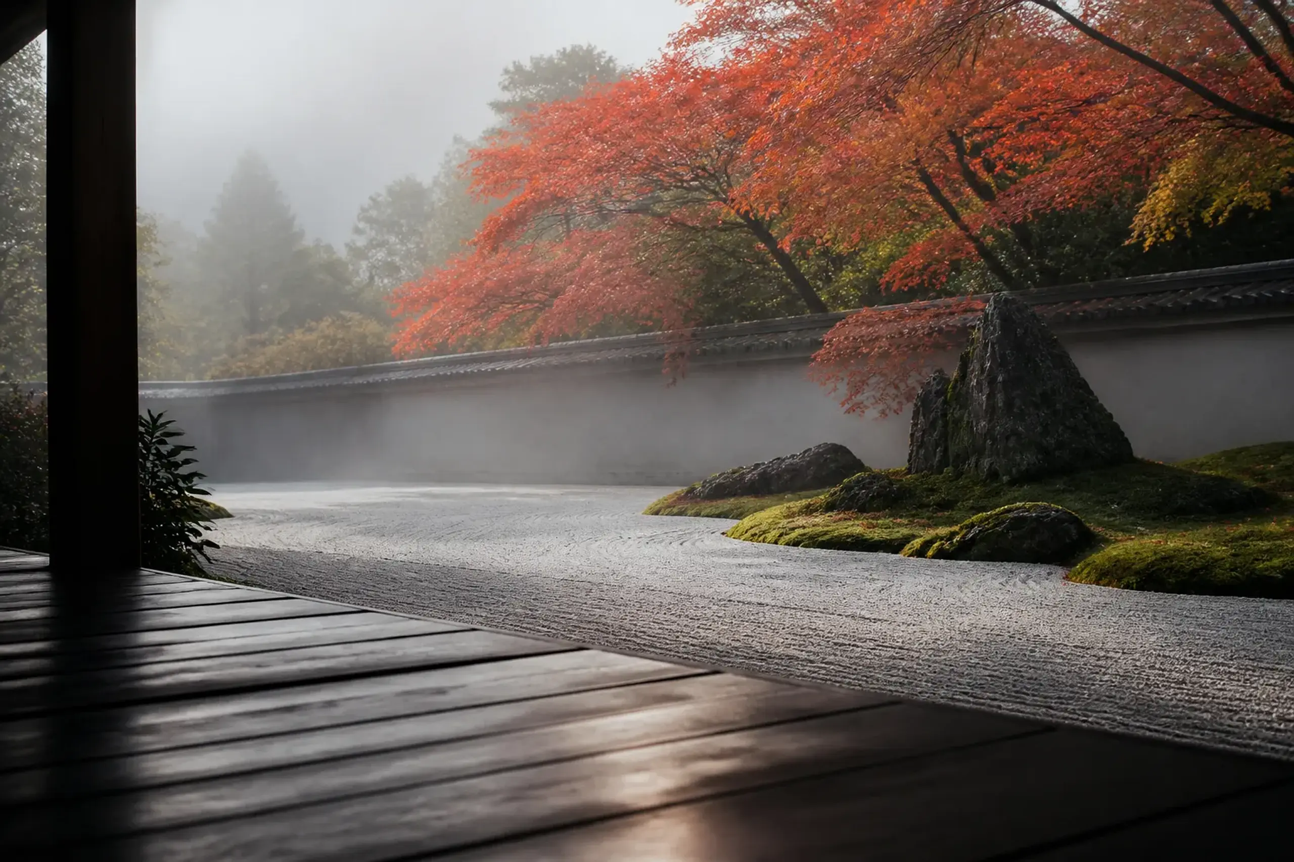 A raked Zen garden with moss and stones at a Kyoto temple in empty early-morning light