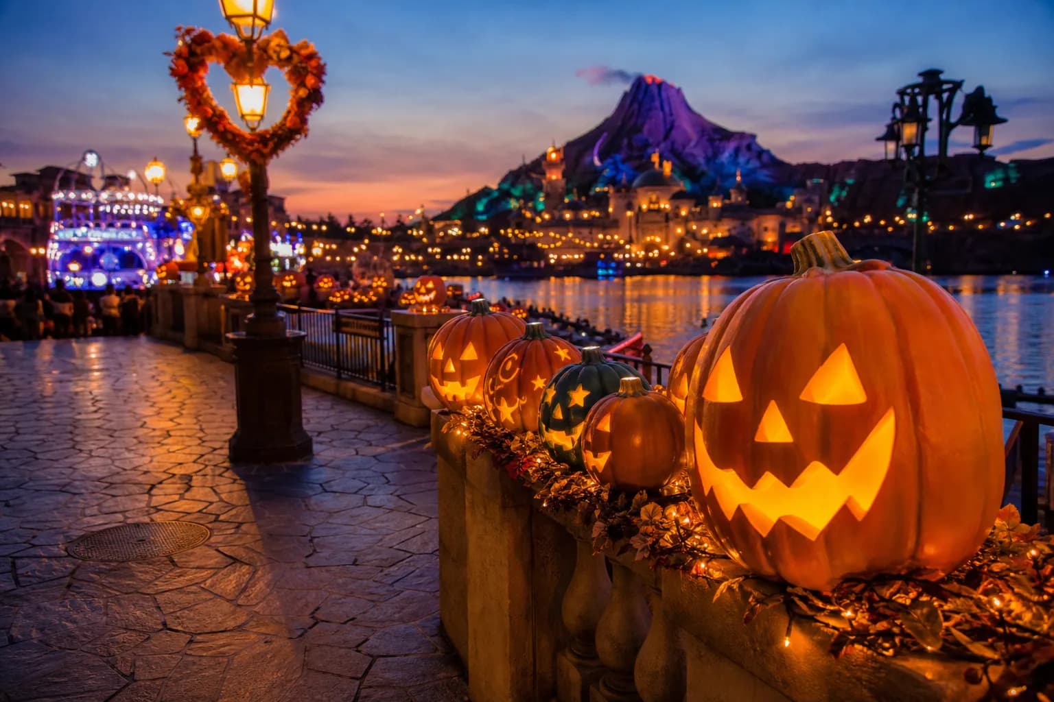 the carved Halloween pumpkins and autumn shadows falling across Mediterranean Harbor at Tokyo DisneySea in early evening light