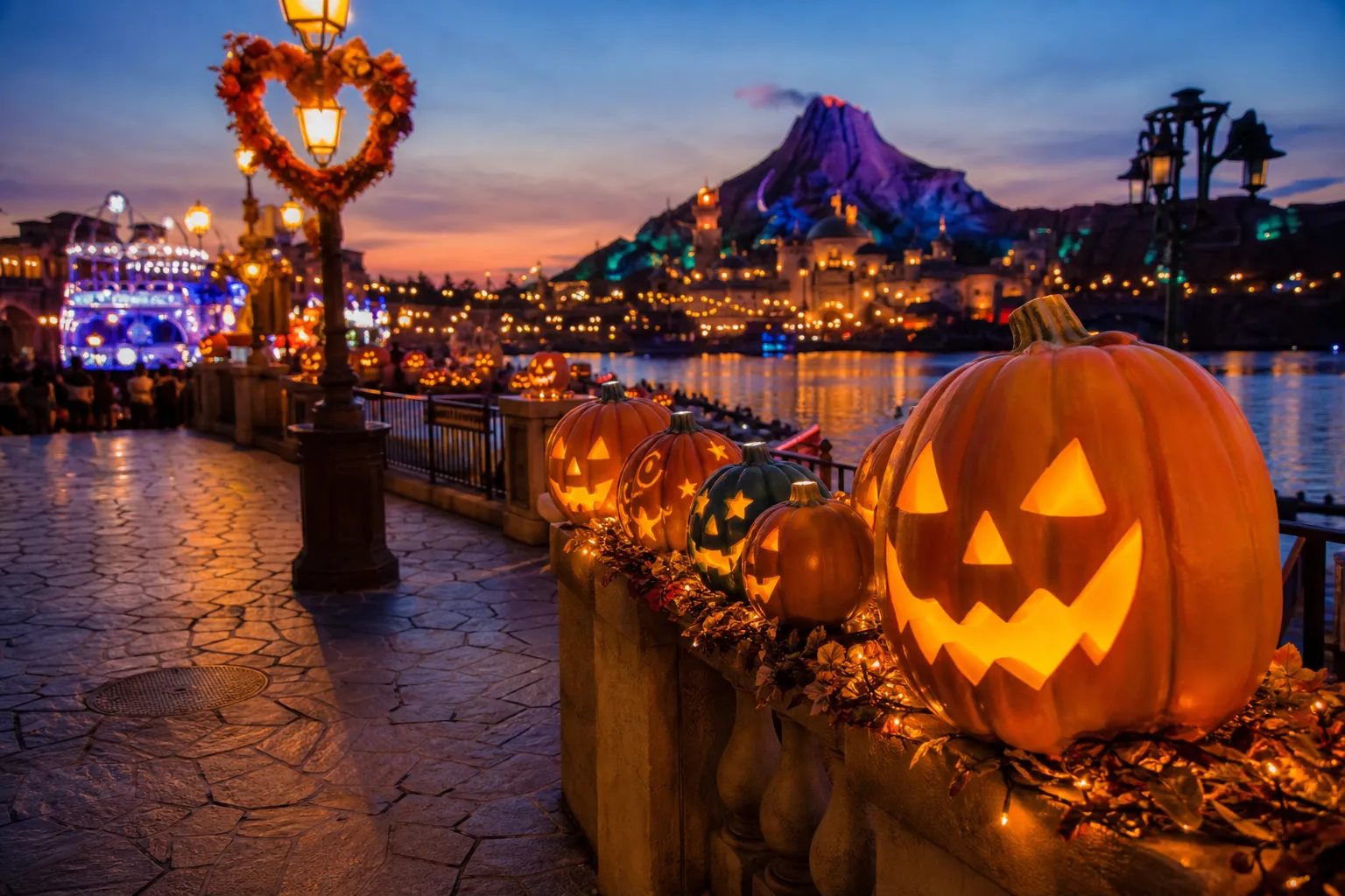 the carved Halloween pumpkins and autumn shadows falling across Mediterranean Harbor at Tokyo DisneySea in early evening light