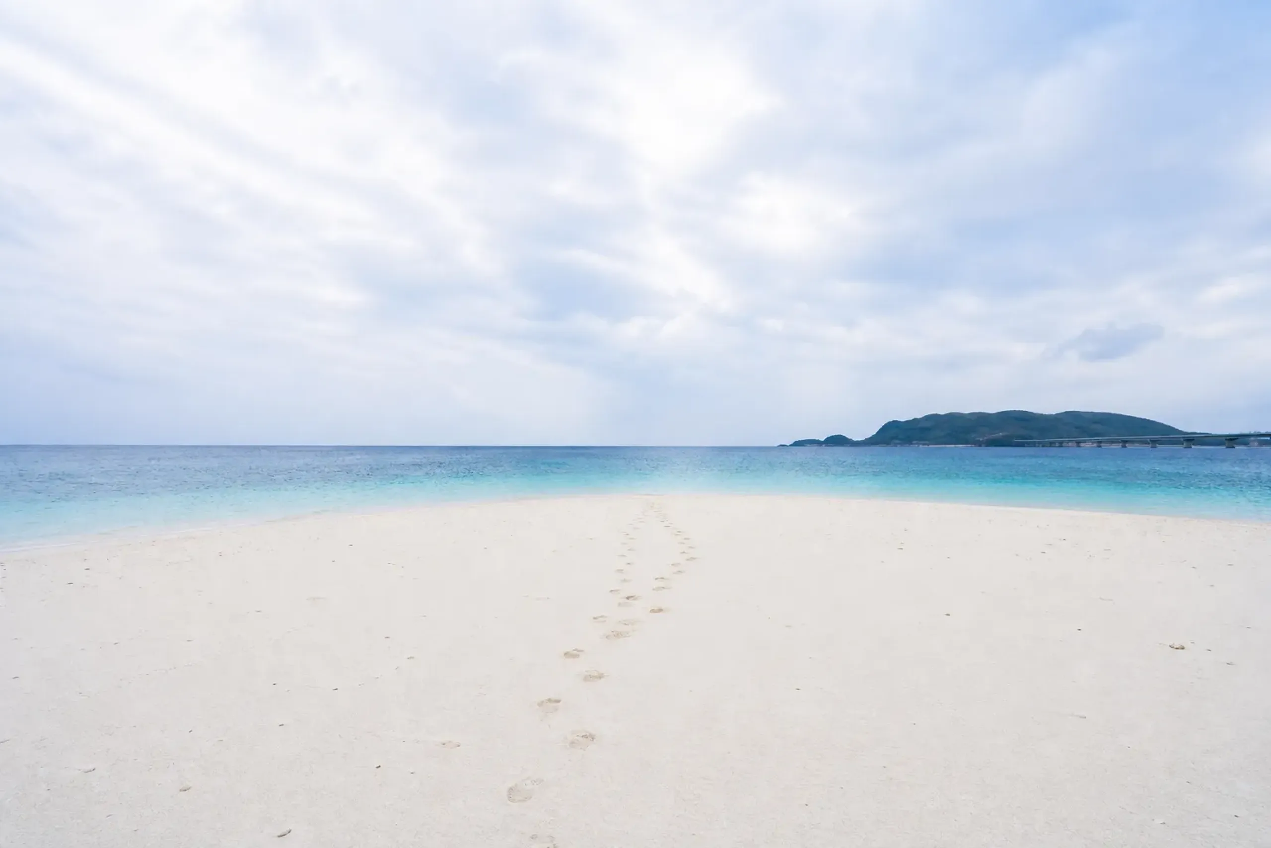 Deserted white-sand beach with turquoise shallows on Aka Island, Kerama