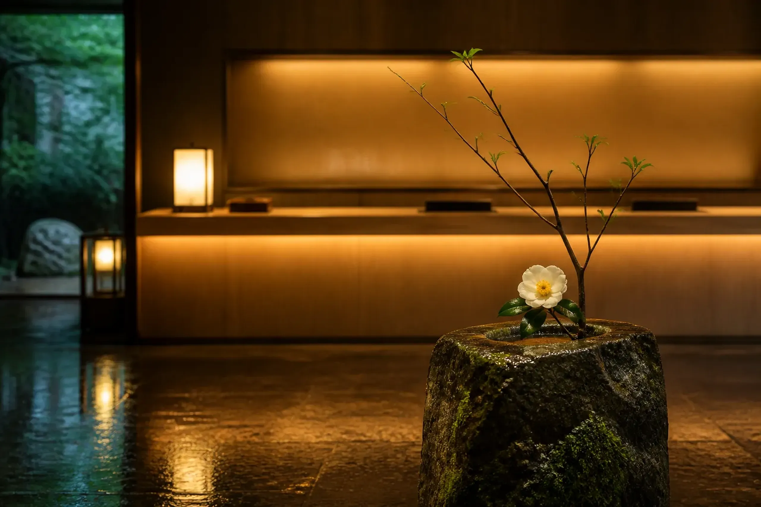 Tokyo luxury hotel lobby with minimalist Japanese design, wood and stone finishes, and soft lighting