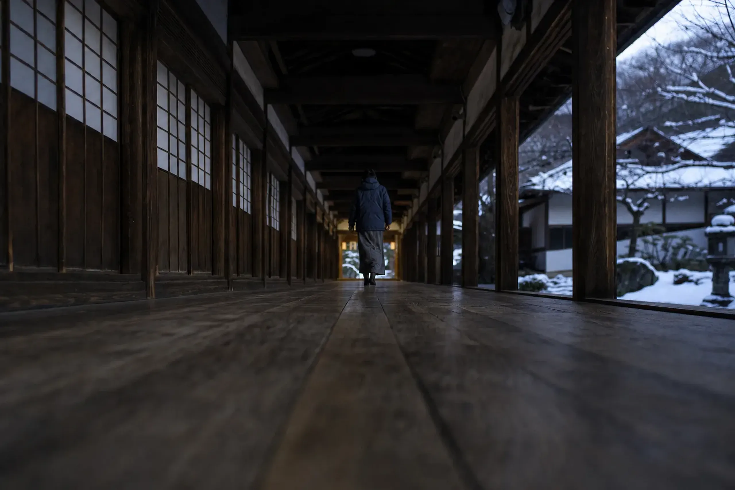 Covered cedar corridor inside Eiheiji Temple in Fukui with soft light and wooden floorboards