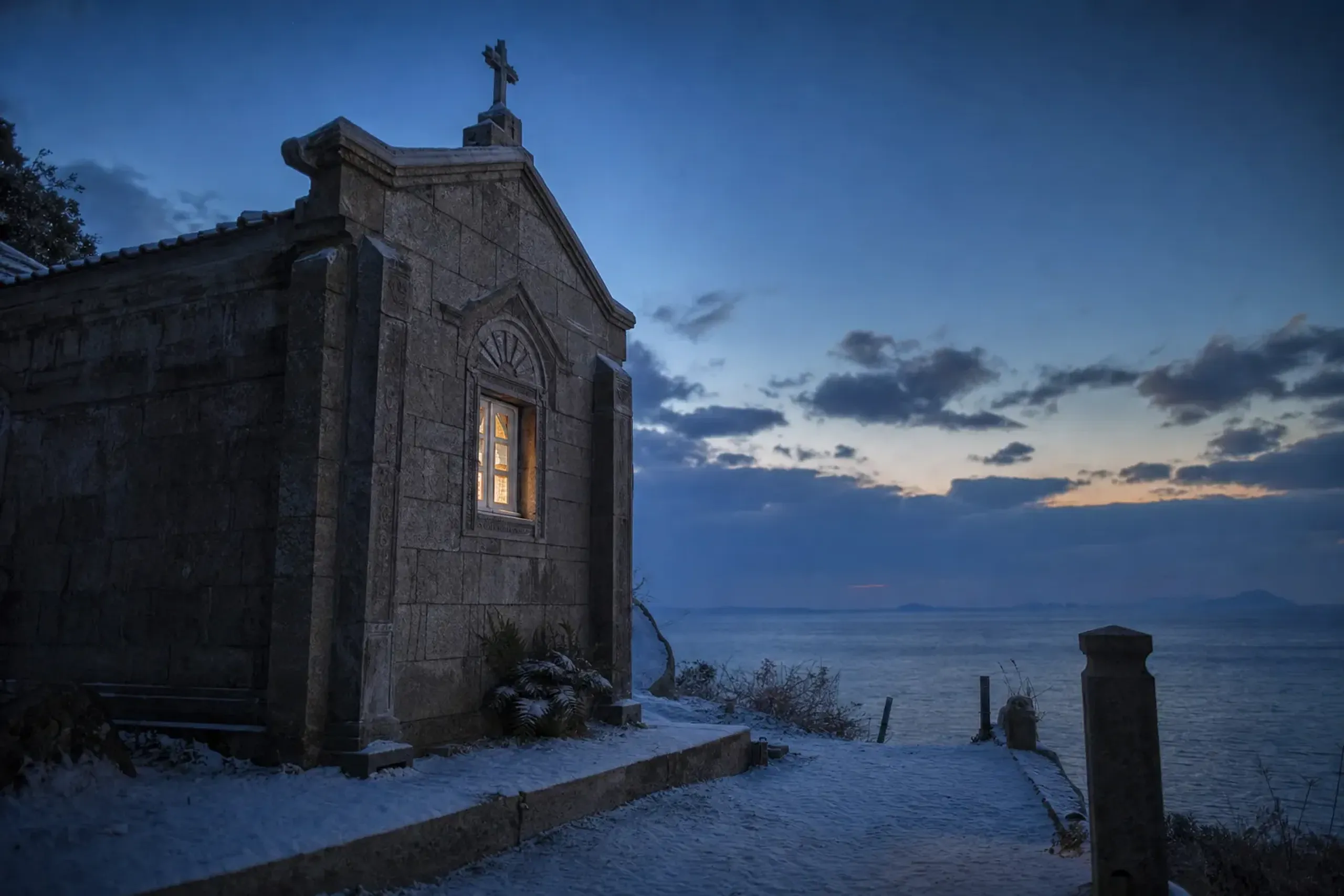 Kashiragashima Church built of stone on Kashiragashima Island, Shin-Kamigotō, overlooking the surrounding sea at dusk