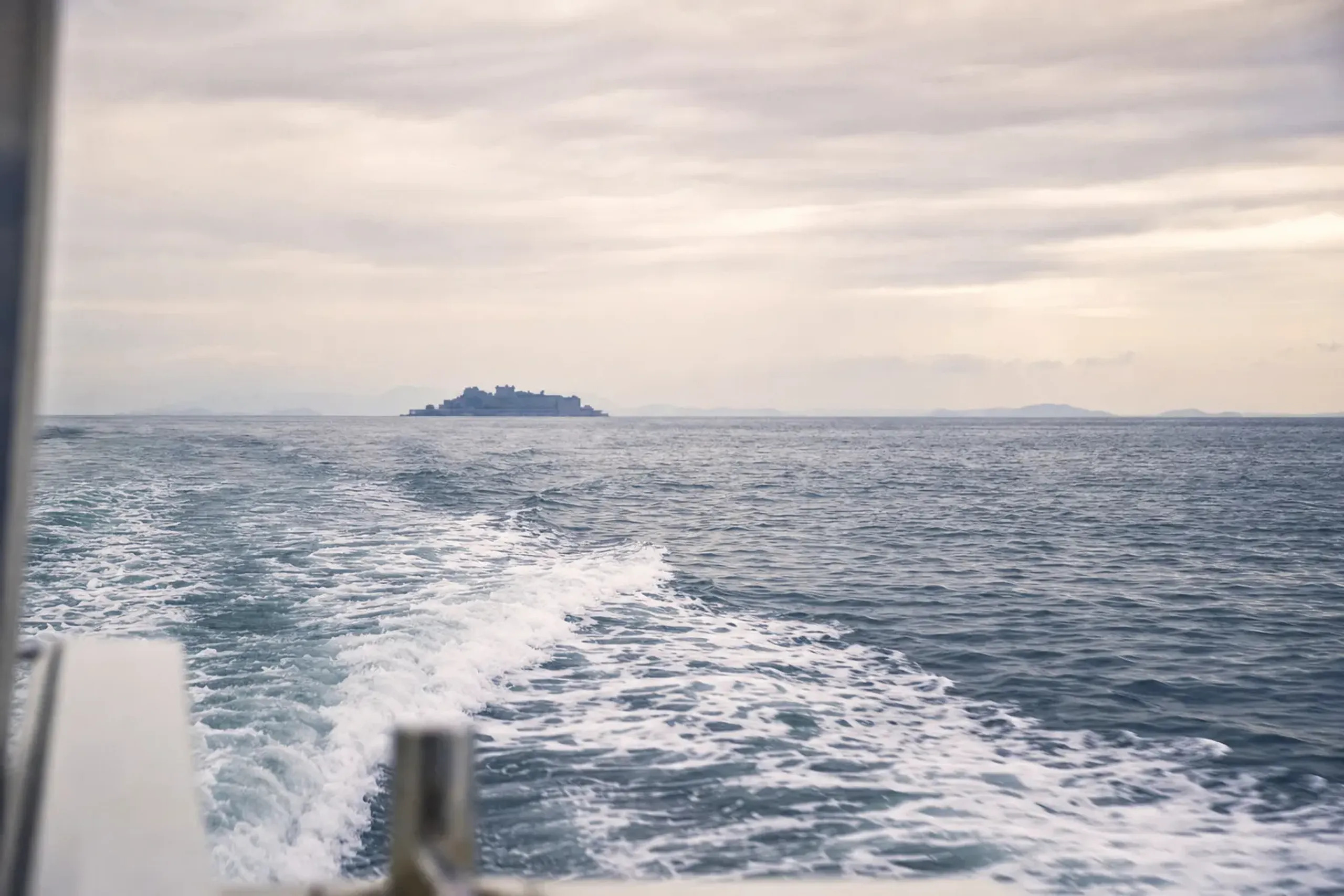 Start with the basic geometry. Hashima is offshore. Boats de