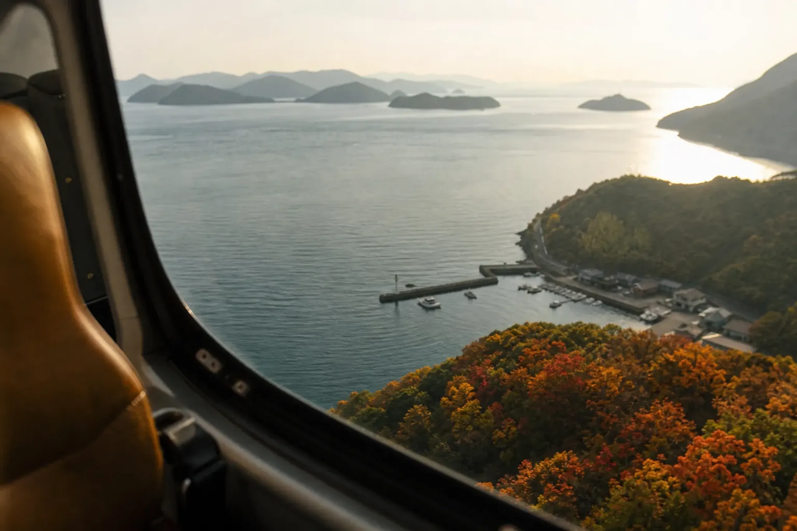 Aerial view of the Seto Inland Sea and its pine-covered islands seen from a helicopter