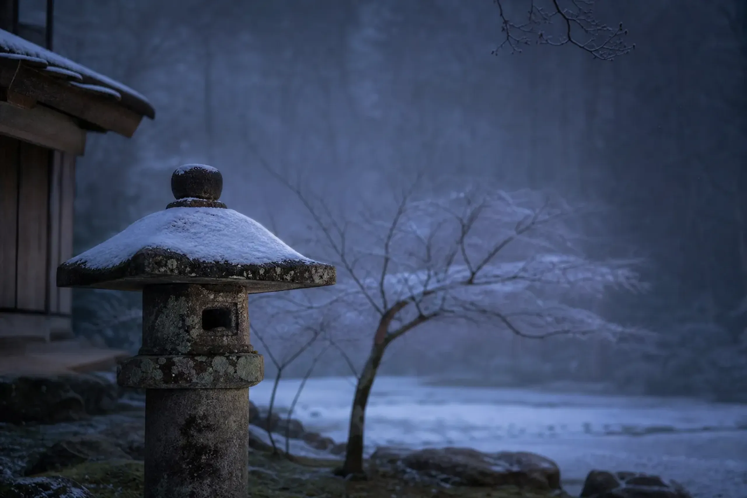 A single ancient stone lanterns faintly in a silent, snowy, empty Nara sub-temple garden during twilight, highlighting weathered wood textures and quiet solitude.