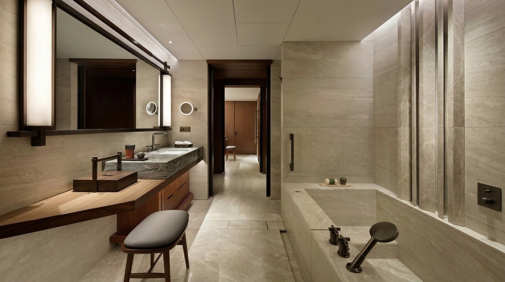 A deep, luxurious natural stone soaking bathtub in a softly lit, modern bathroom.