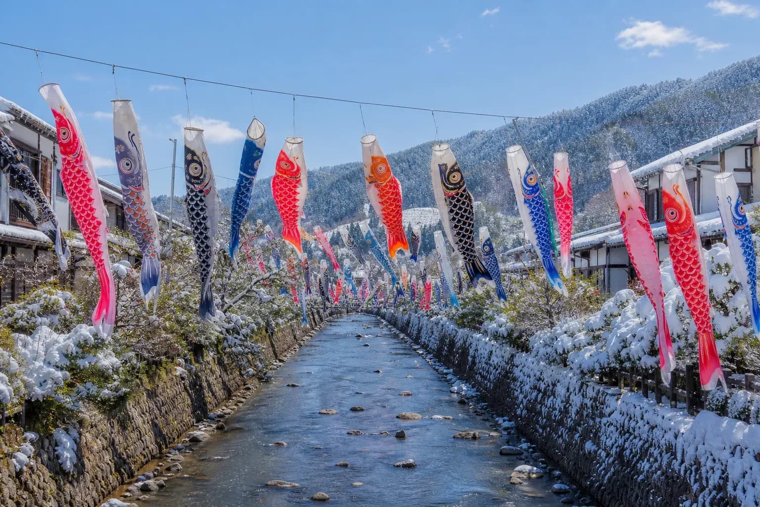Koinobori carp streamers flying over a Japanese neighborhood during Golden Week 2026