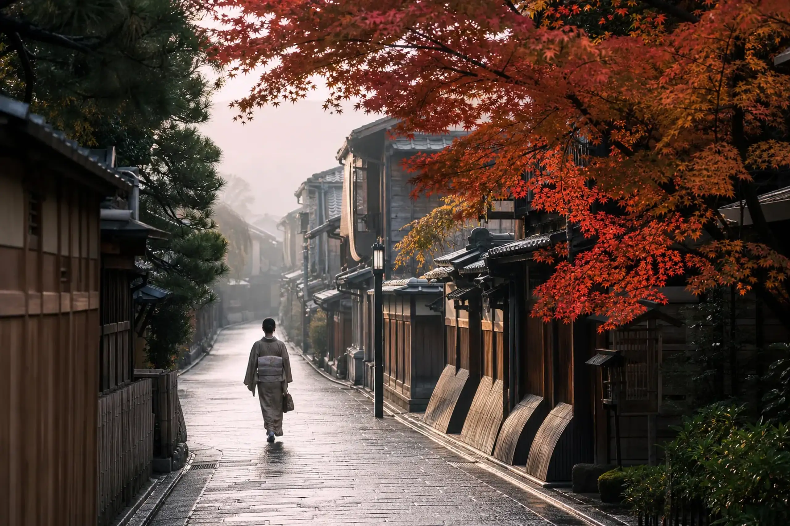 Quiet Kyoto street in early morning with traditional townhouses and few people