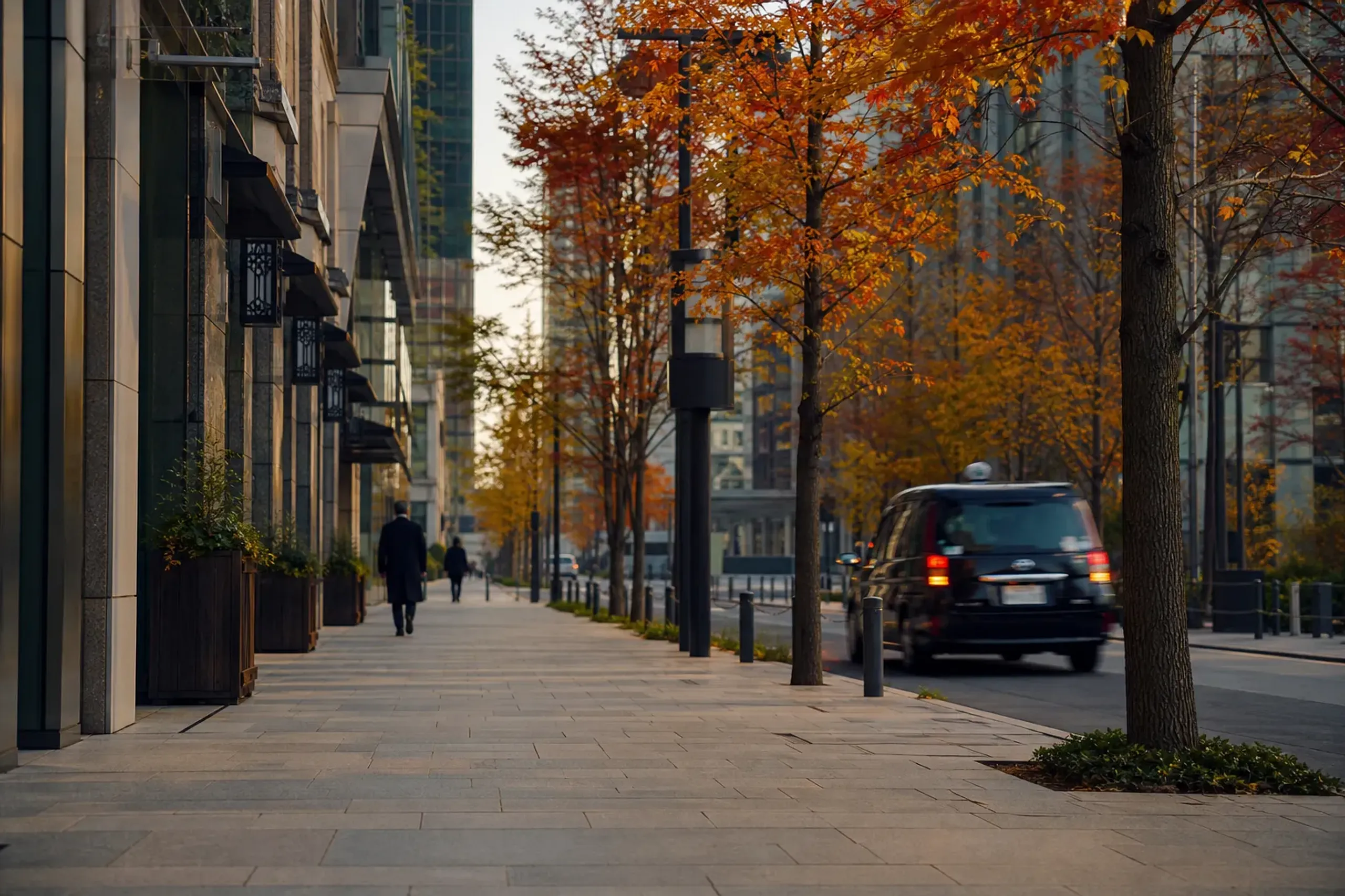 Quiet morning street in Marunouchi, Tokyo with wide sidewalks and minimal pedestrians