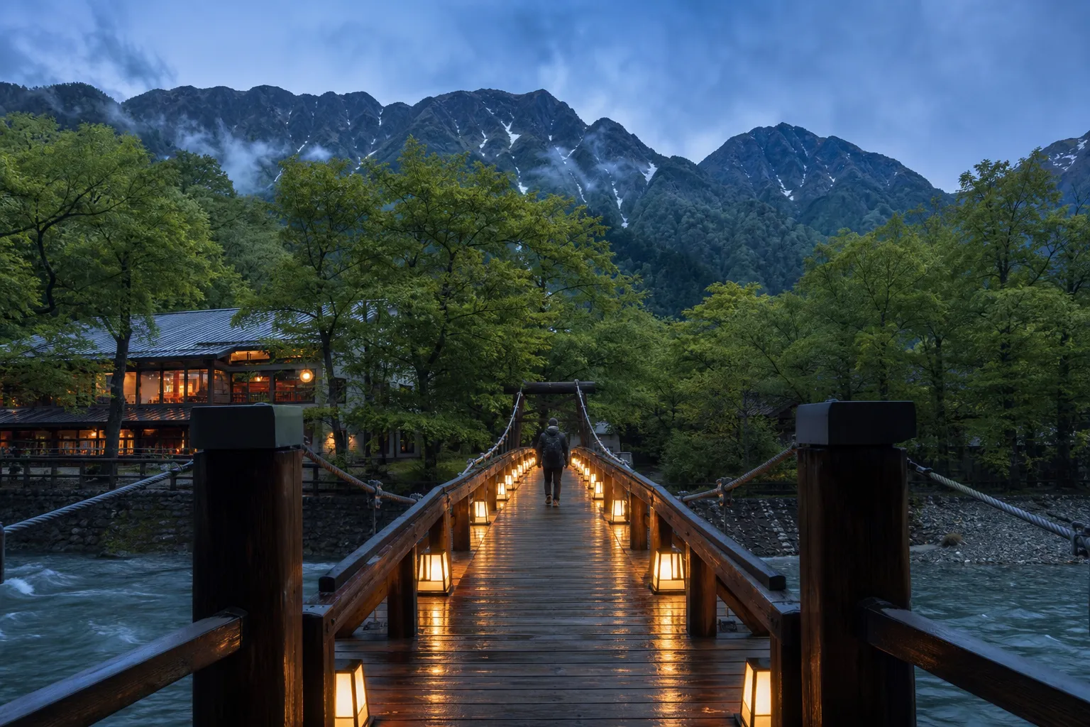 Wooden Kappabashi suspension bridge over the Azusa River in Kamikochi with mountains behind