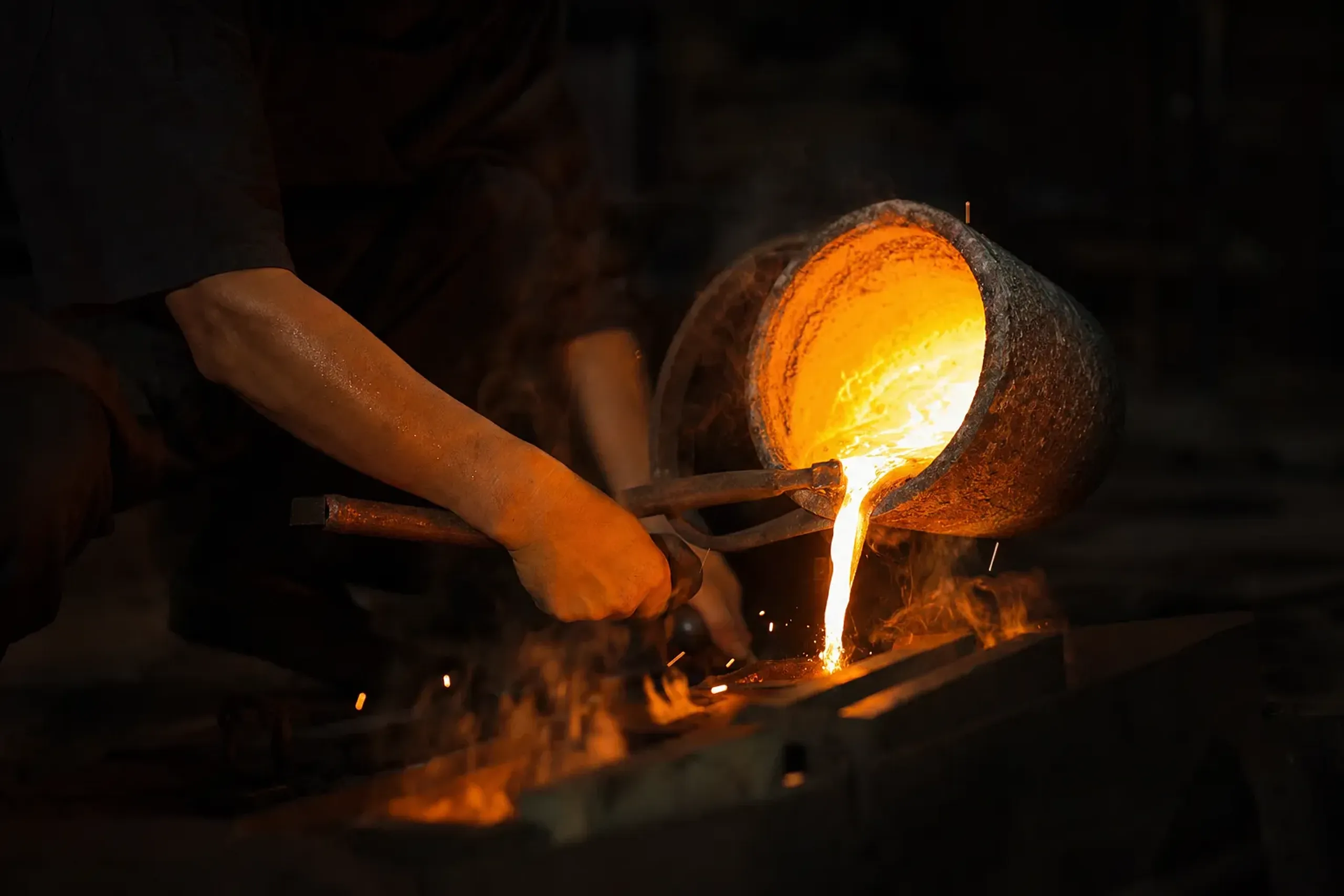 molten gold alloyed with trace silver and copper being poured in a Kanazawa foundry crucible