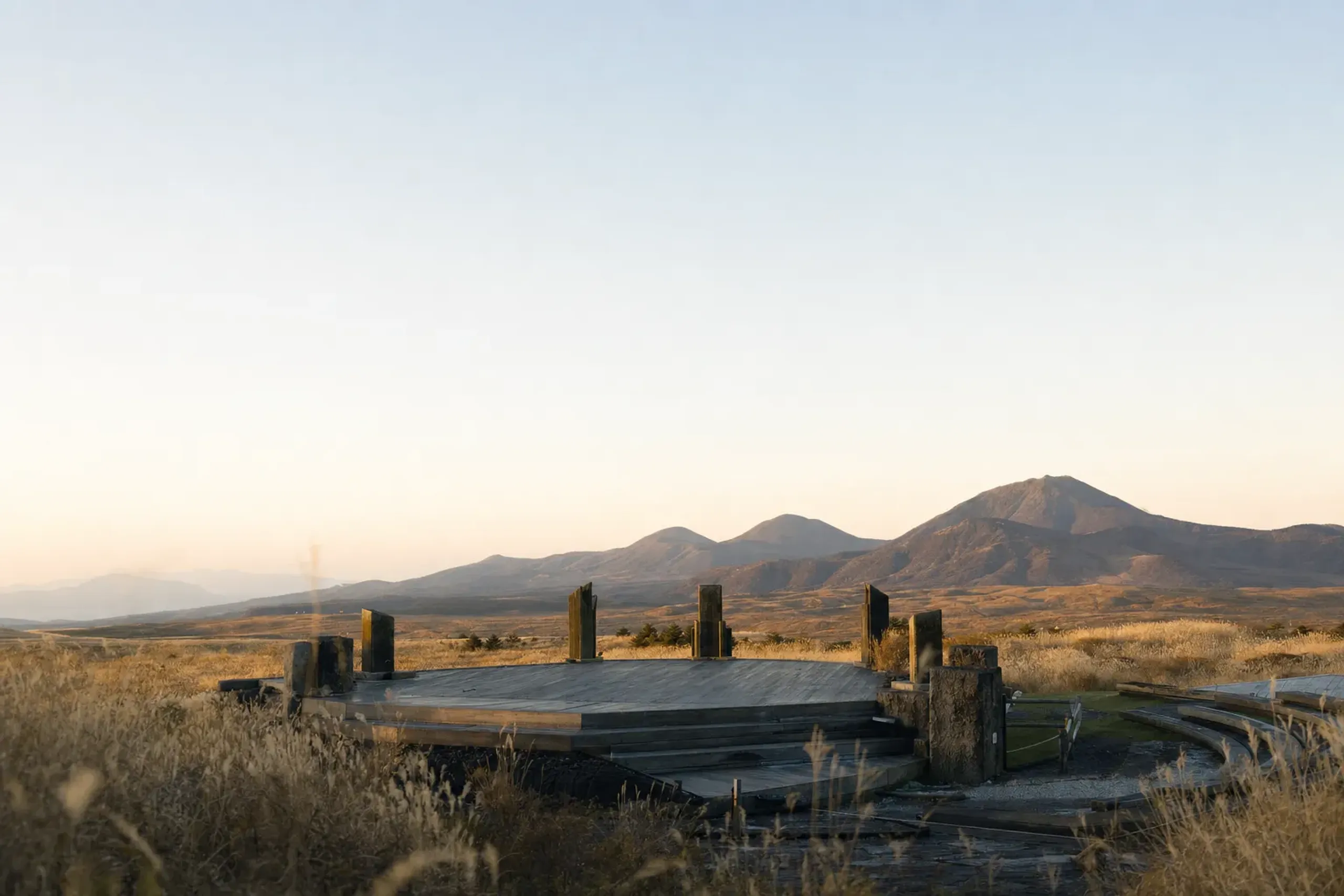 The TAO no Oka permanent open-air theatre venue on the Kuju Plateau, its stage set against the raw highland landscape
