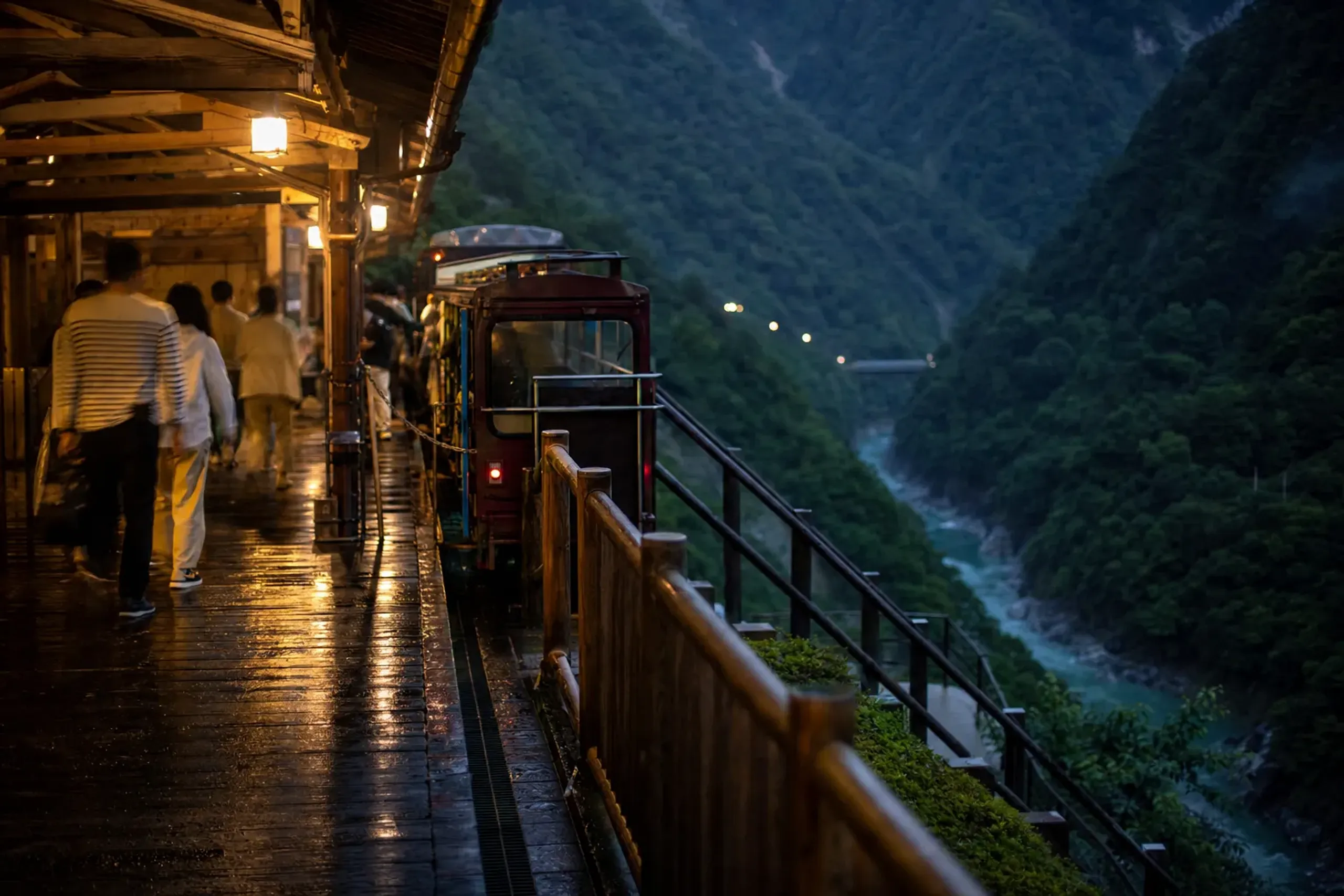 The narrow-gauge train stopped at Nekomata Station, the cat-named turnaround terminus, passengers emptying from the open cars in the Kurobe Gorge