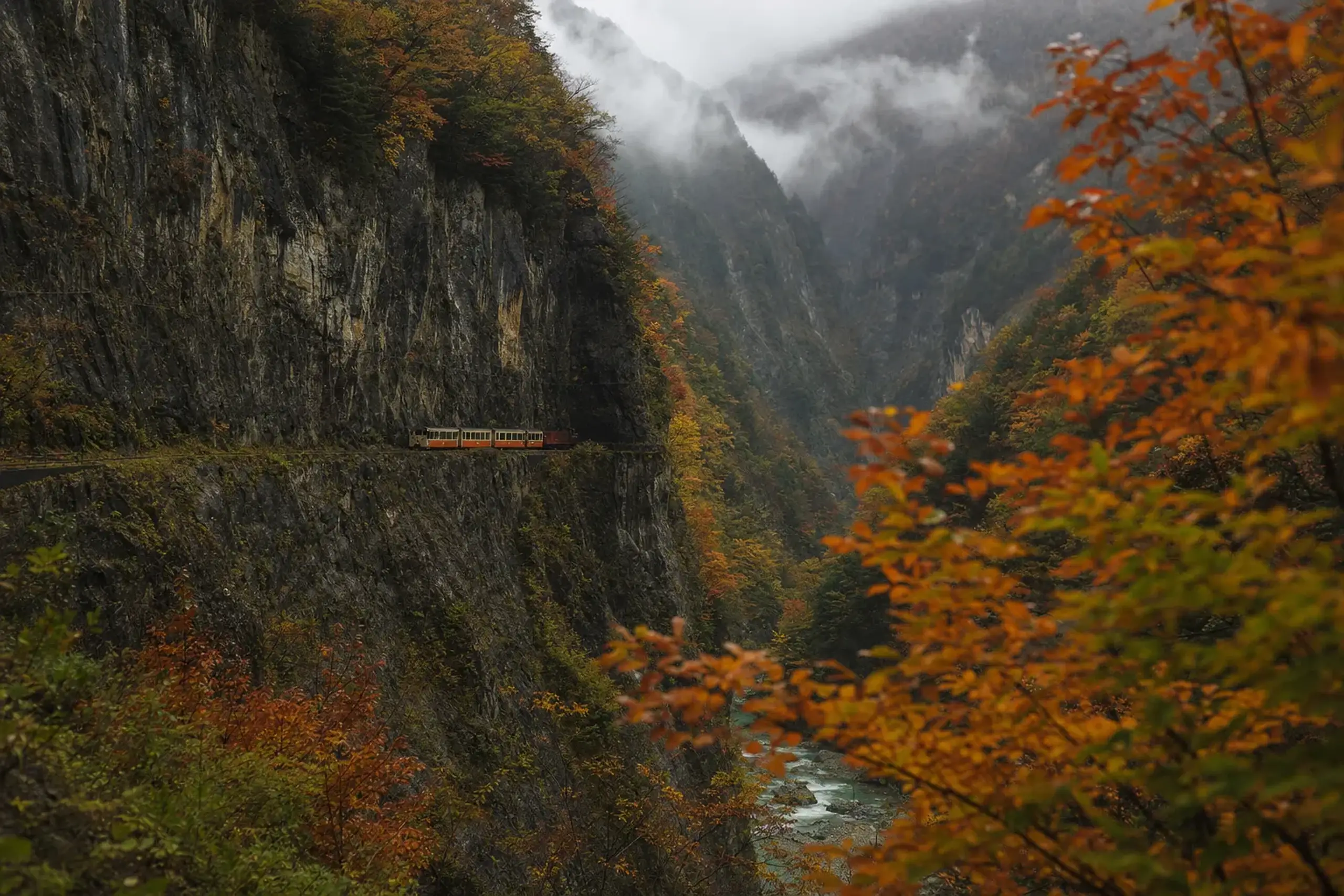 The full 20.1-kilometre narrow-gauge line stitching along ledges toward Keyakidaira Station high in Japan's deepest V-shaped valley