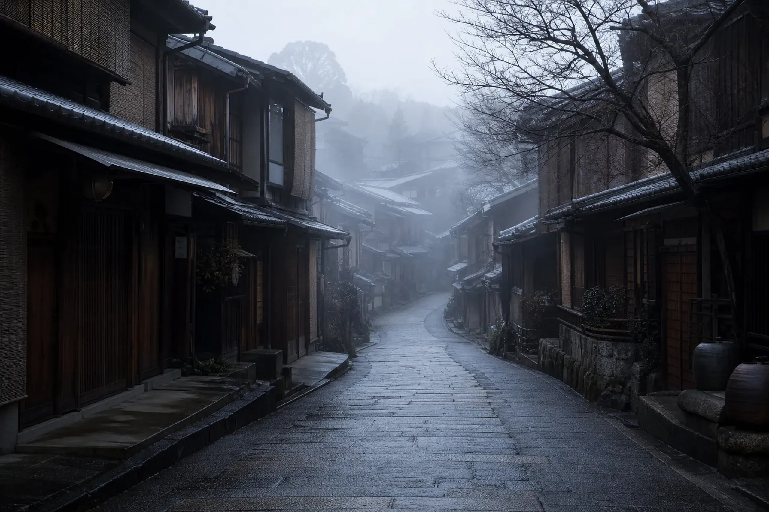 Misty early-morning stone lane in Higashiyama Kyoto lined with traditional wooden machiya and no crowds