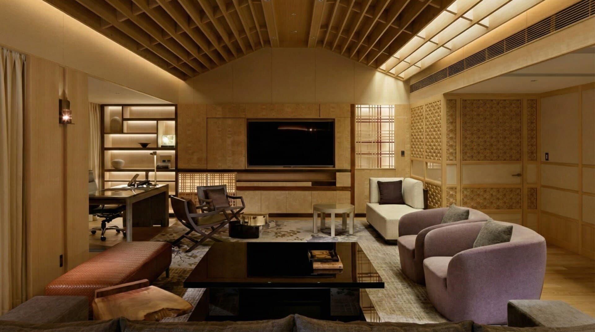The spacious living area of the Four Seasons Hotel Kyoto Presidential Suite features modern furnishings and Japanese decor.