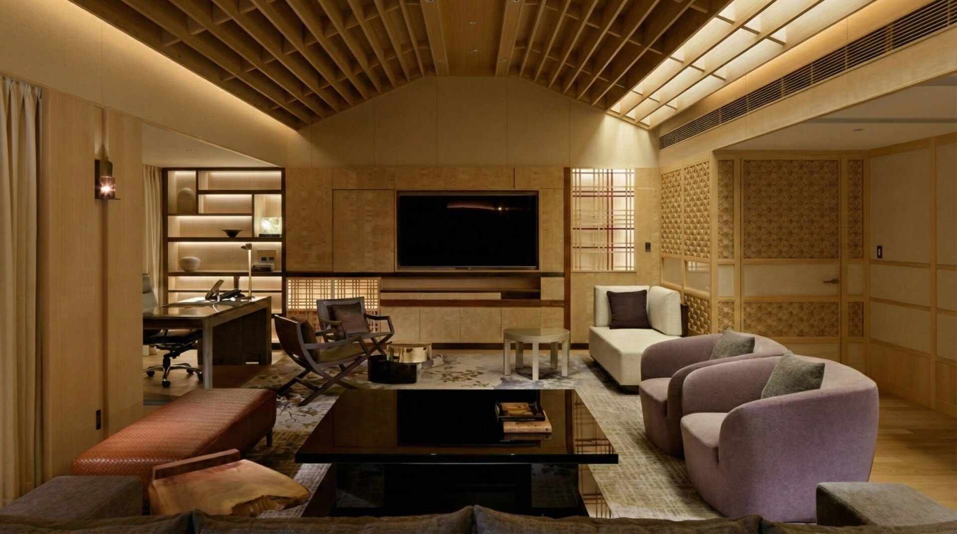 The spacious living area of the Four Seasons Hotel Kyoto Presidential Suite features modern furnishings and Japanese decor.