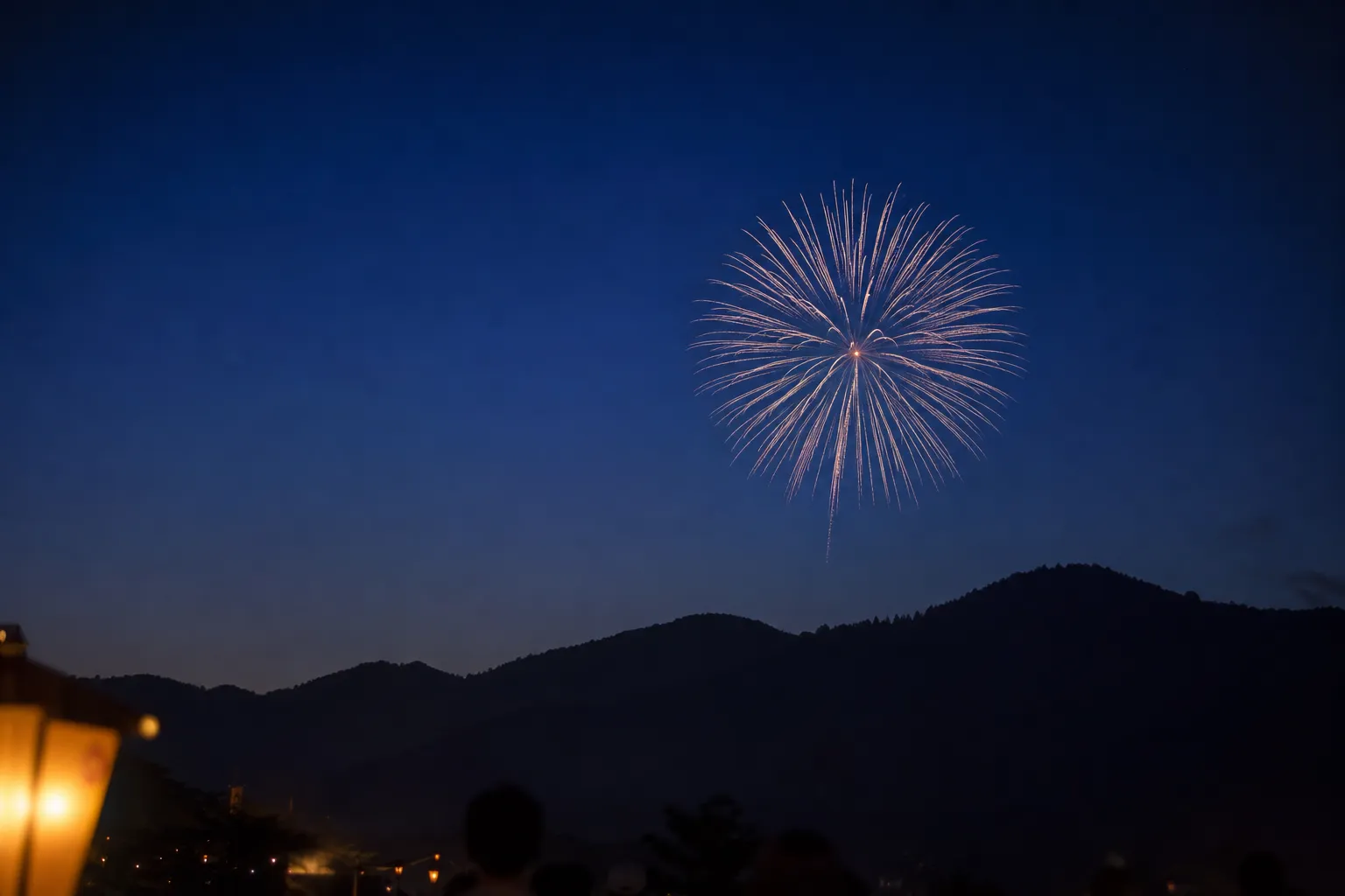 Fireworks lighting the sky over Nakafurano during a summer festival evening in Hokkaido