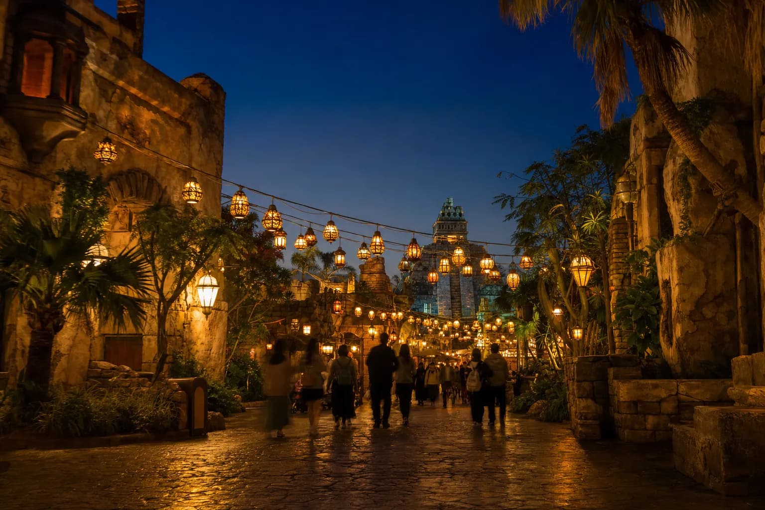 Evening view of Lost River Delta at Tokyo DisneySea with lantern-lit walkways and themed architecture