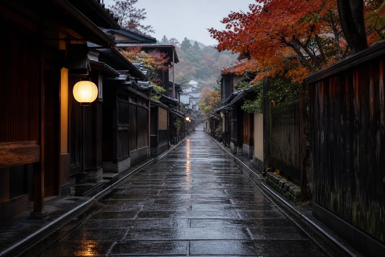 Quiet Kyoto lane in early morning with wet stone pavement and traditional wooden facades