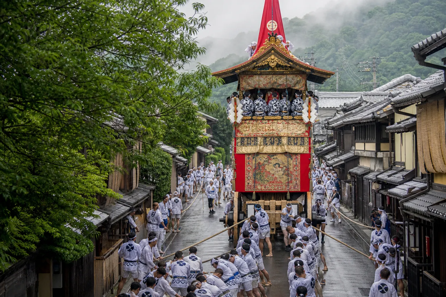 Tall traditional Gion Matsuri float pulled through a Kyoto street during the July procession