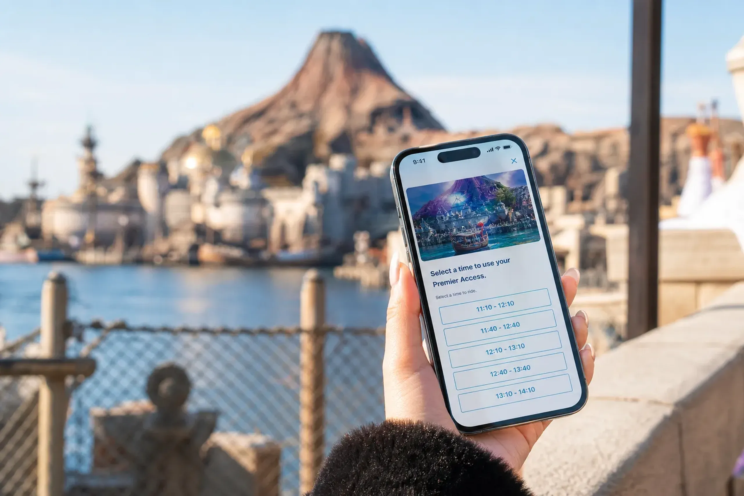 Smartphone showing the Tokyo Disney Resort App used for Disney Premier Access planning