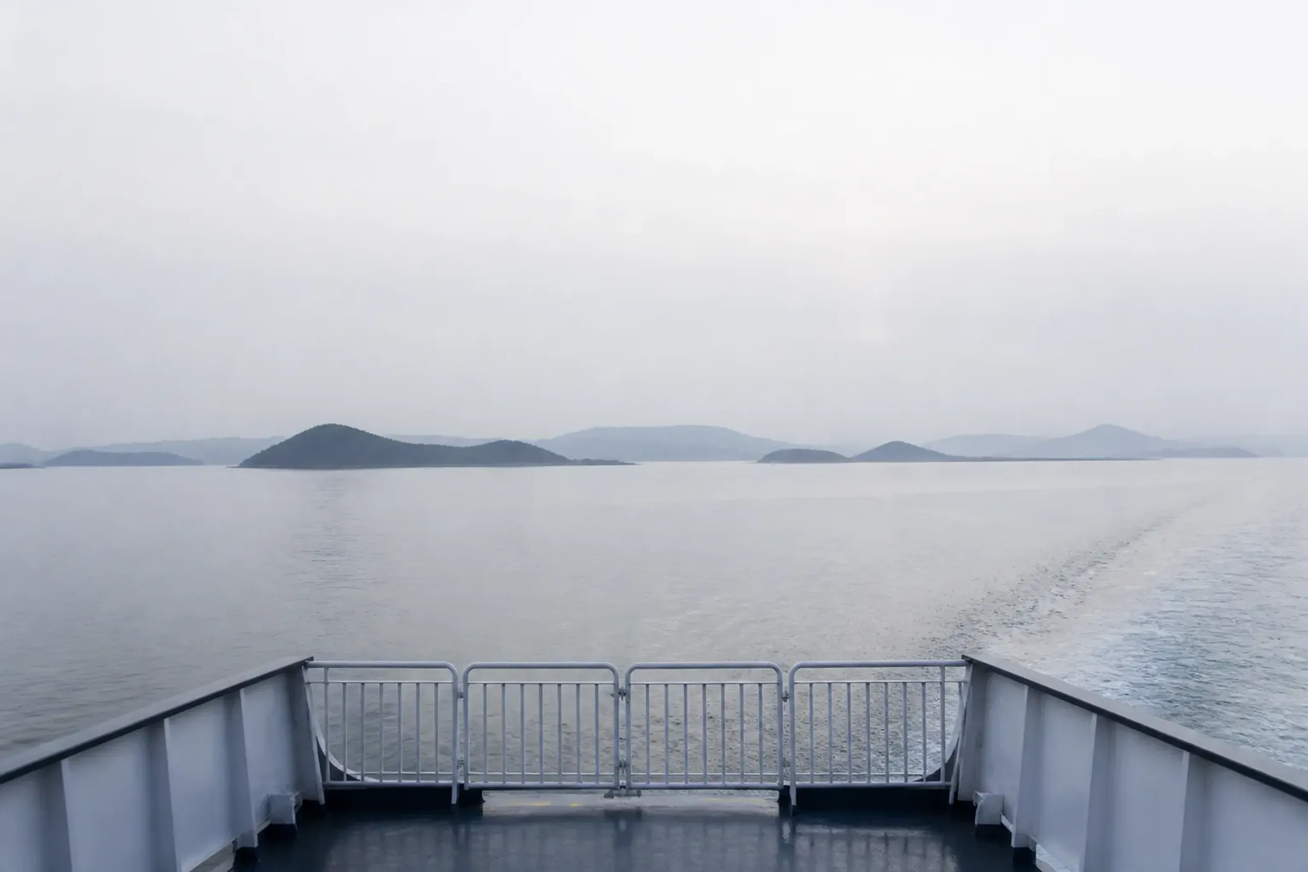 the calm island-dotted waters of the Seto Inland Sea viewed from the Miyajima ferry crossing