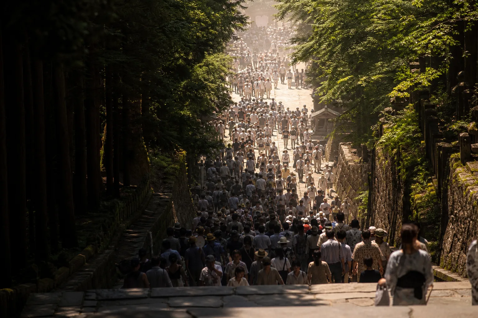 Crowds on the stone steps and approach paths near Kumano Nachi Taisha on festival day in July