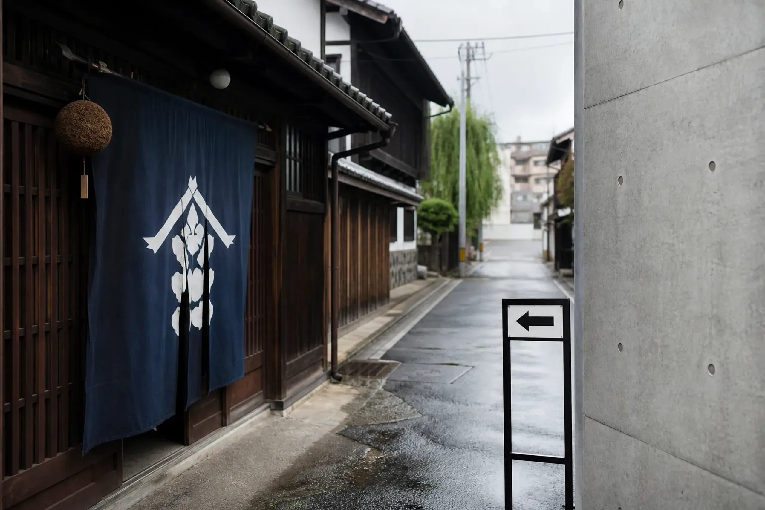Brewery street scene in Kobe’s Nada area with signage for sake museums and modern buildings