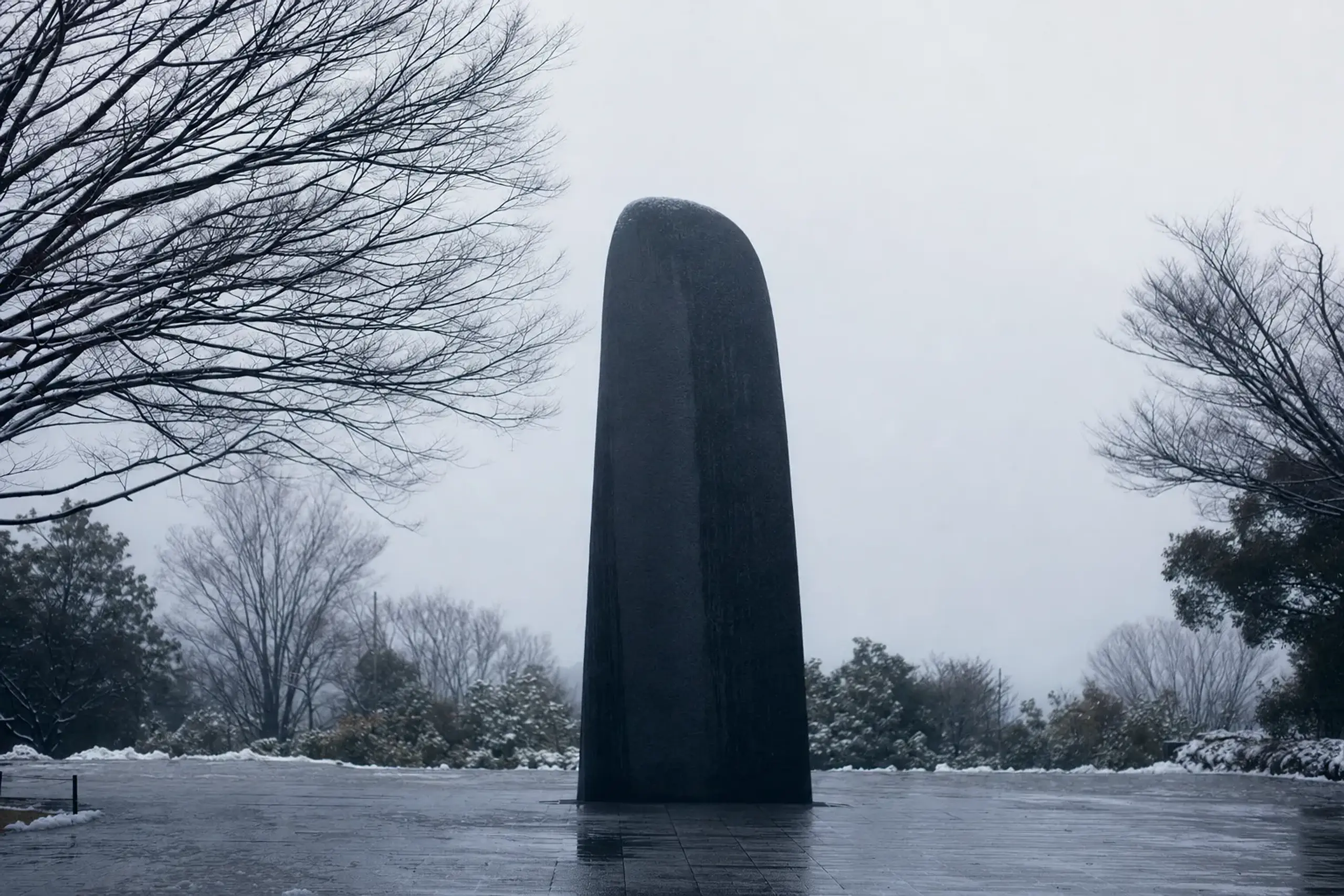Black monolith marking the atomic bomb epicenter in Nagasaki's Hypocenter Park