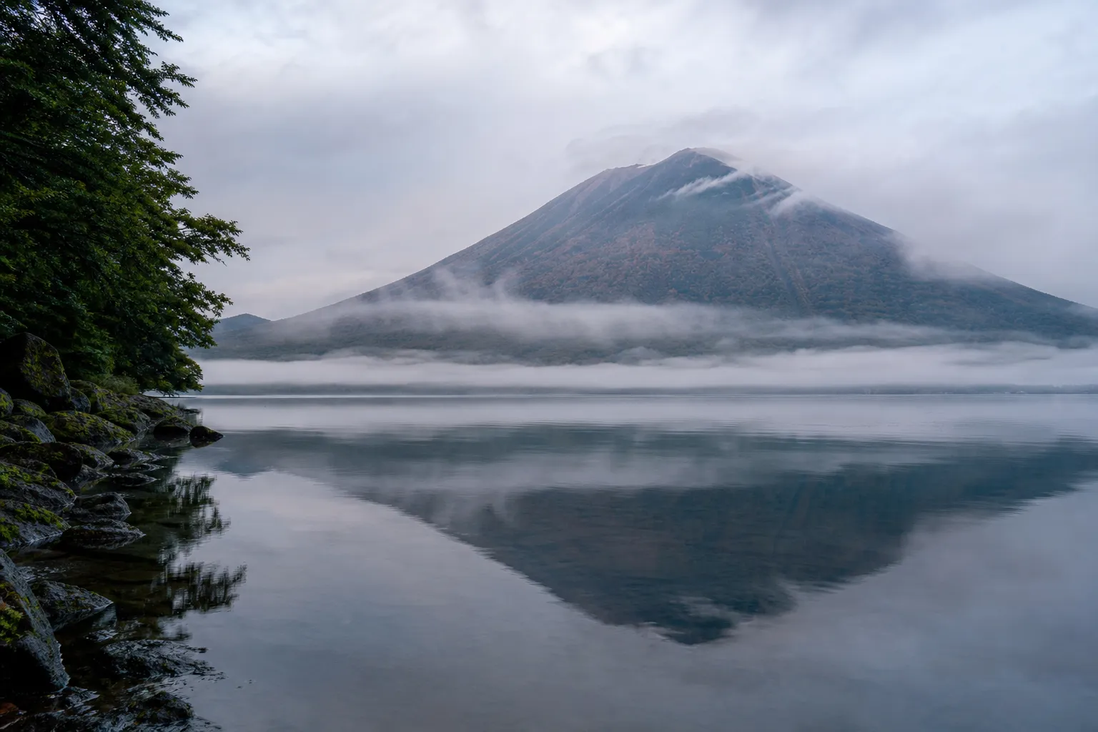 Mt. Nantai on Lake Chuzenji during the autumn season in Nikko, Japan.