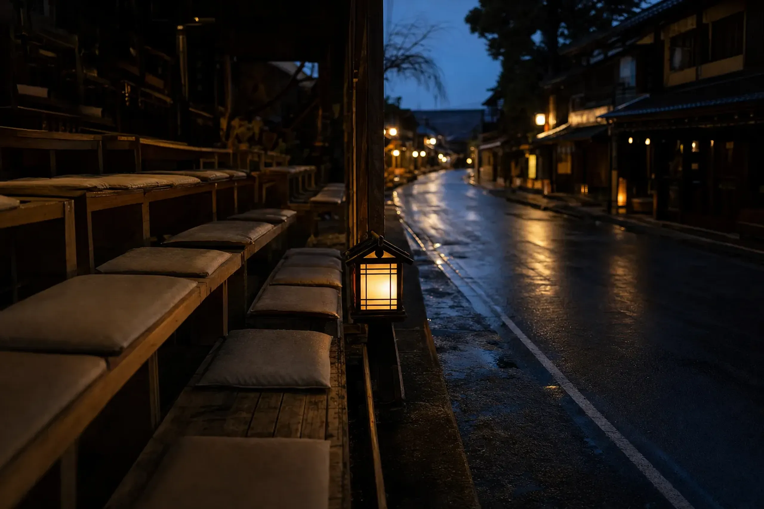 Rows of paid roadside viewing seats set along the edge of Nishimonai Honcho Street facing the dance loop