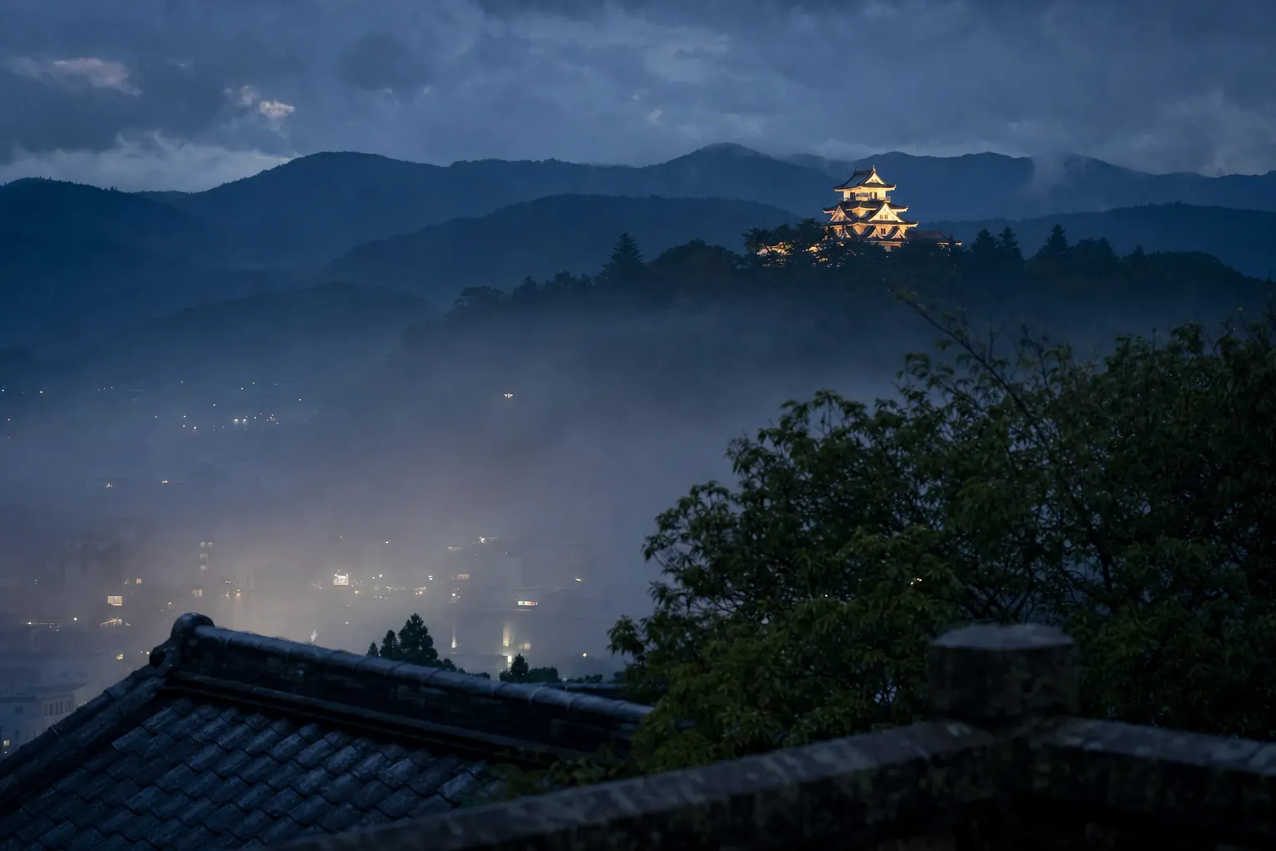 Gujō Hachiman Castle perched on a wooded hilltop above the town in central Gifu