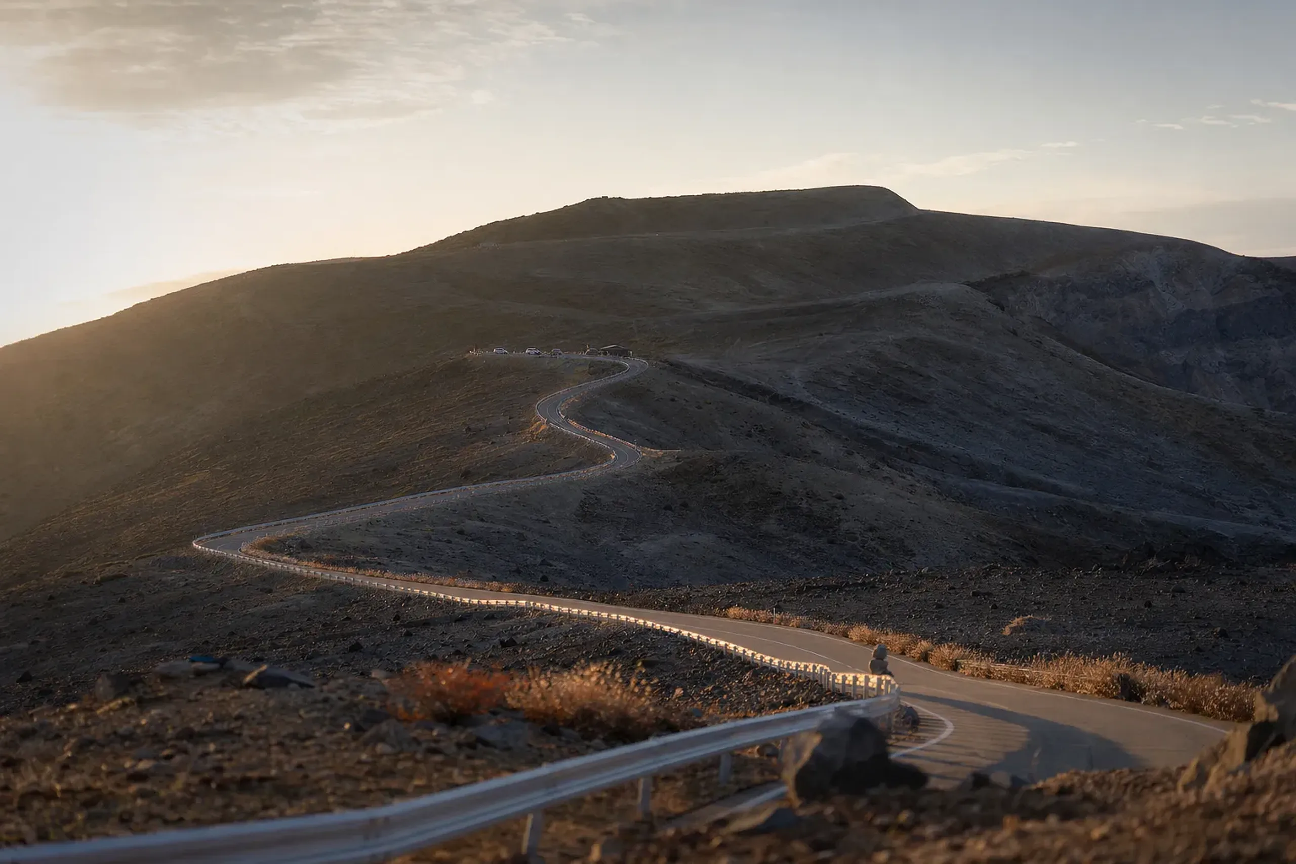 the winding Zaō Highline road ascending through open volcanic terrain toward the summit-area parking near Okama crater