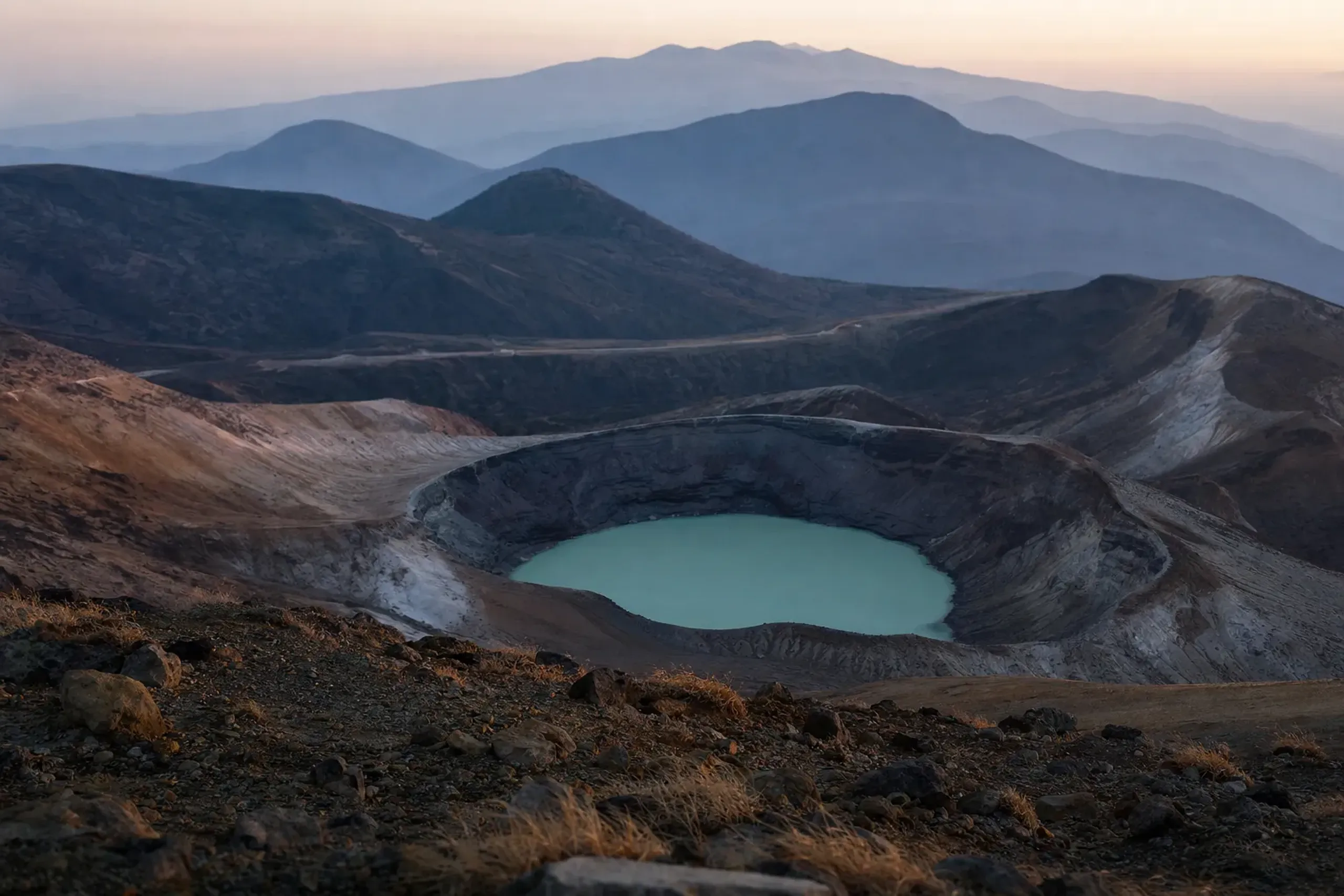a final elevated vantage over the Okama crater basin encircled by the peaks Katta-dake, Kumano-dake, and Goshiki-dake