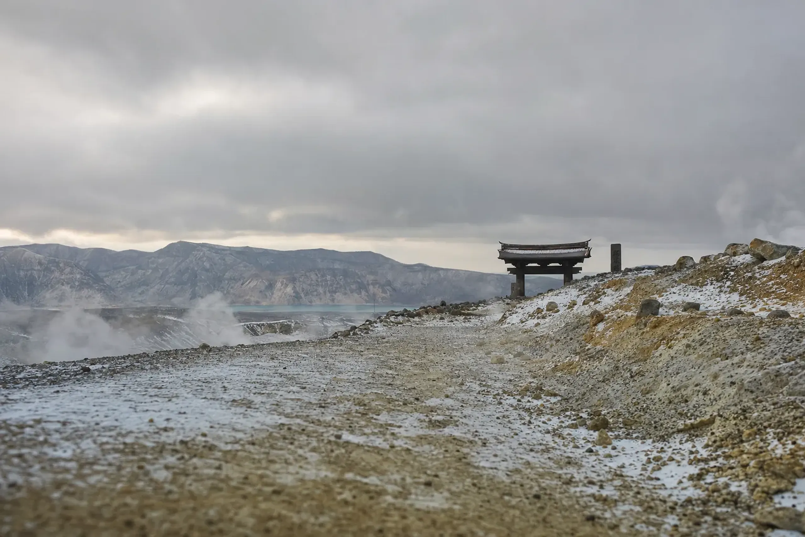 The remote Shimokita Peninsula landscape at the northern tip of Aomori, showing the isolated volcanic crater approach toward Bodaiji temple