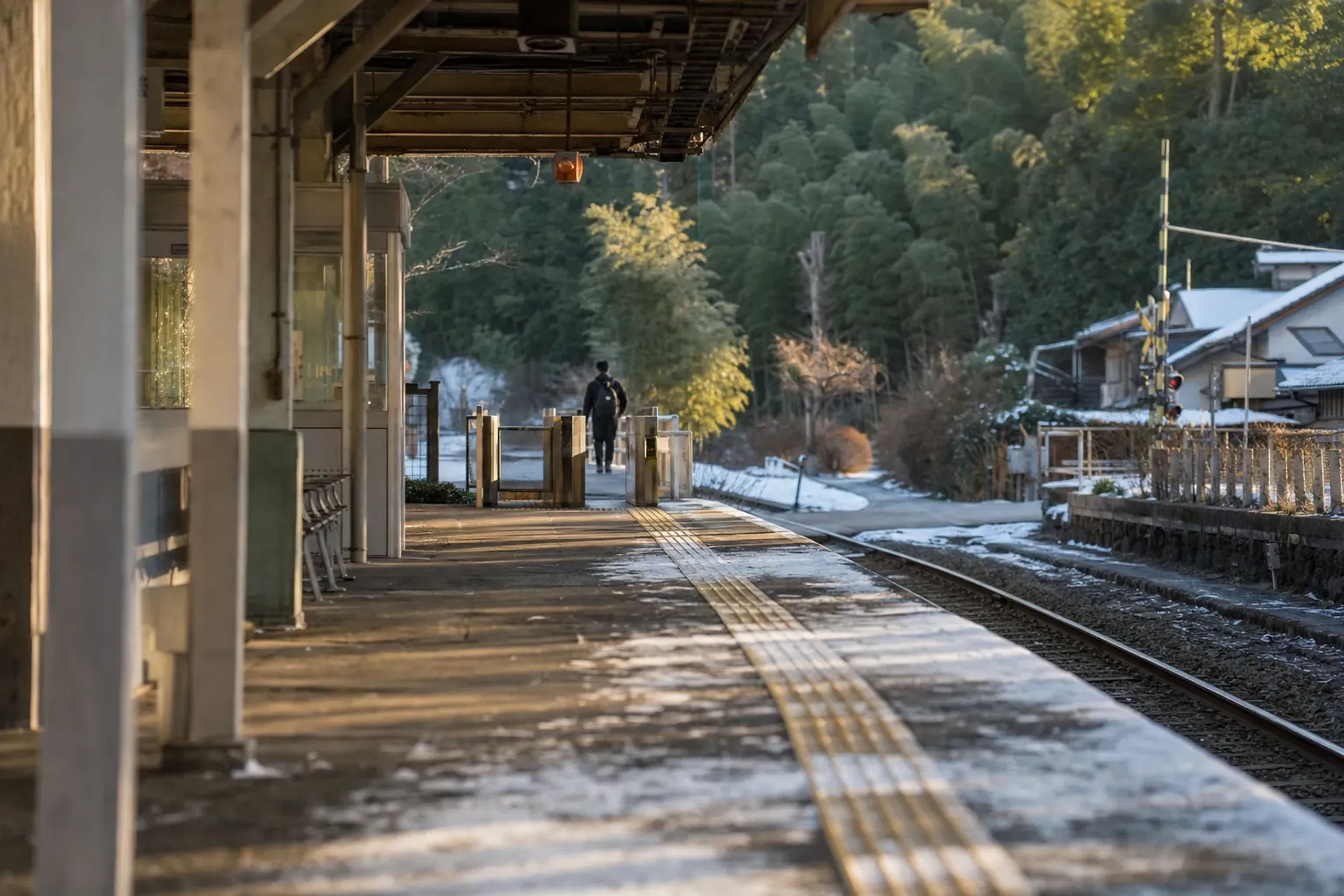 The rail platform and station approach at Higashimuko Station leading toward the Otokuni bamboo area
