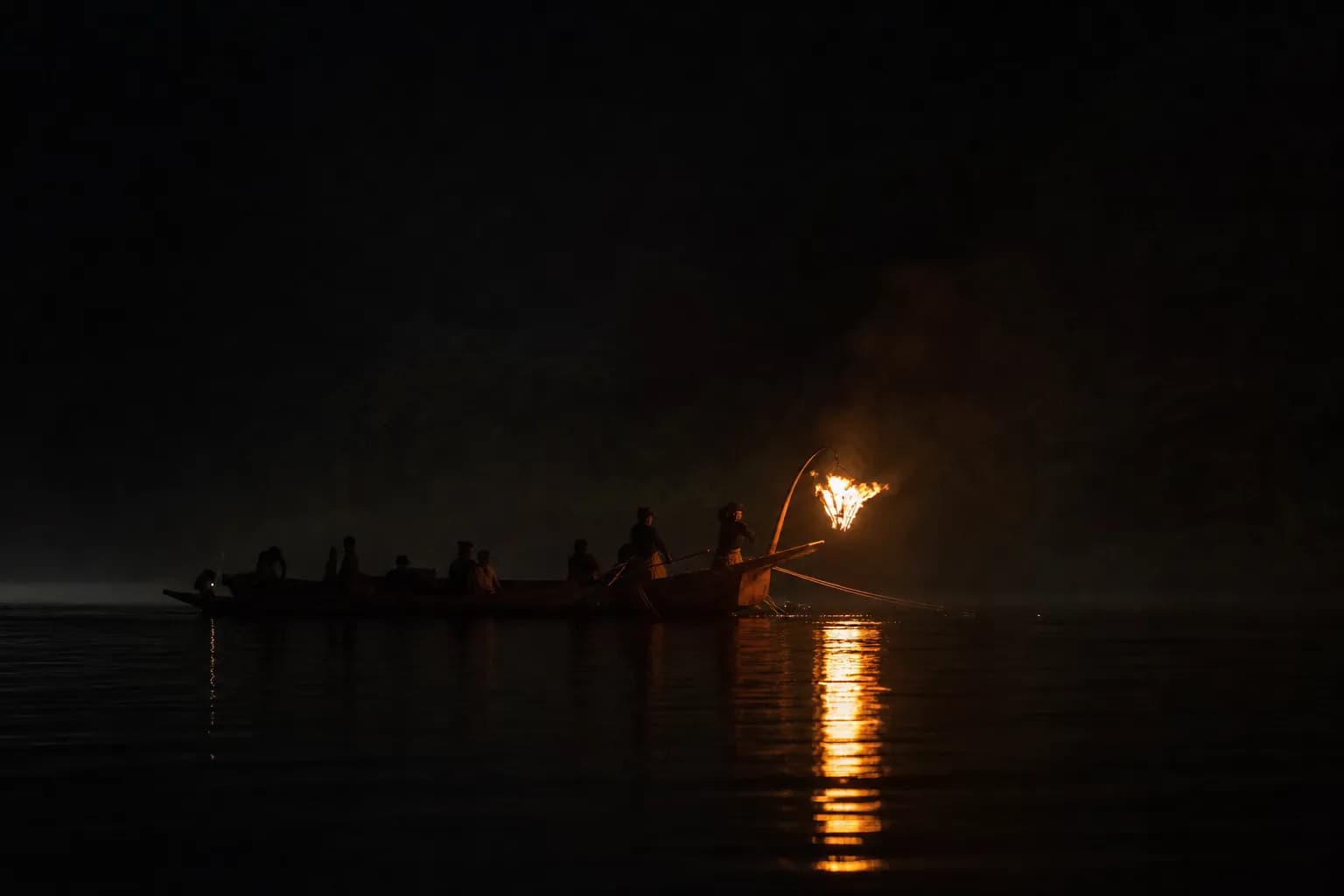 Two boats traveling side-by-side during Awase Ukai on the Hijikawa River in Ozu at night