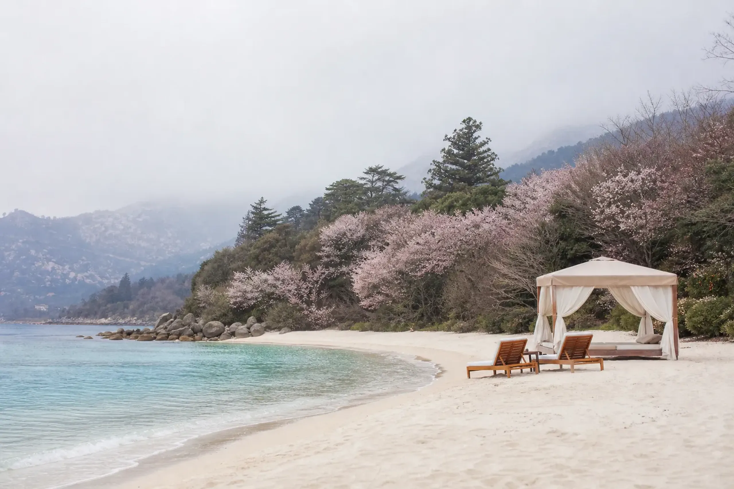 Quiet Okinawa resort beach with a private cabana and empty loungers by turquoise water